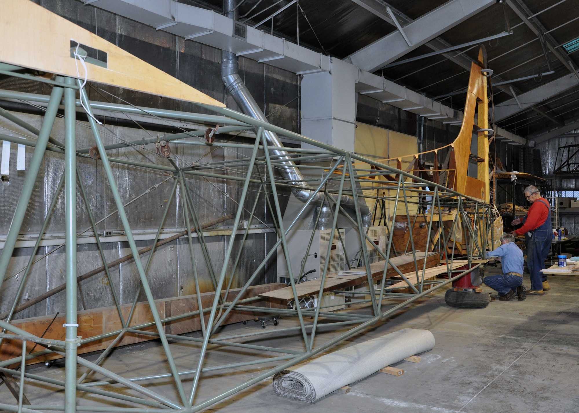Gary White (left) and Arthur Miller work on the tail section of a CG-4A glider at Whiteman Air Force Base, Mo., Feb. 28. The glider is being restored by volunteers.The 442nd Fighter Wing is an A-10 Thunderbolt II Air Force Reserve unit at Whiteman. (U.S. Air Force photo/Senior Airman Wesley Wright)