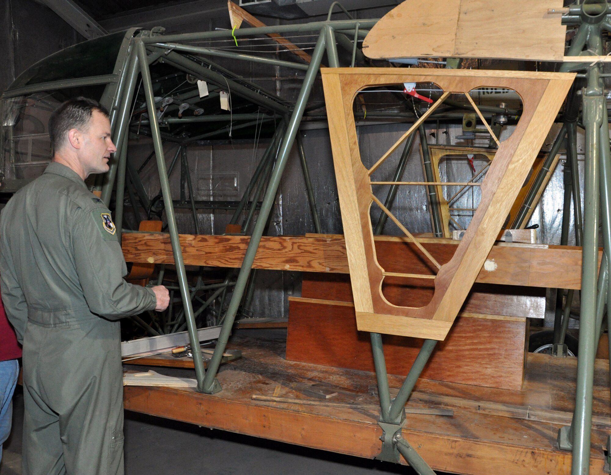 Brig. Gen. (then Col.) Eric Overturf, 442nd Fighter Wing Commander, examines the emergency exit on a CG-4A glider at Whiteman Air Force Base, Mo., Feb. 28. The glider is being restored by volunteers.The 442nd Fighter Wing is an A-10 Thunderbolt II Air Force Reserve unit at Whiteman. (U.S. Air Force photo/Senior Airman Wesley Wright)