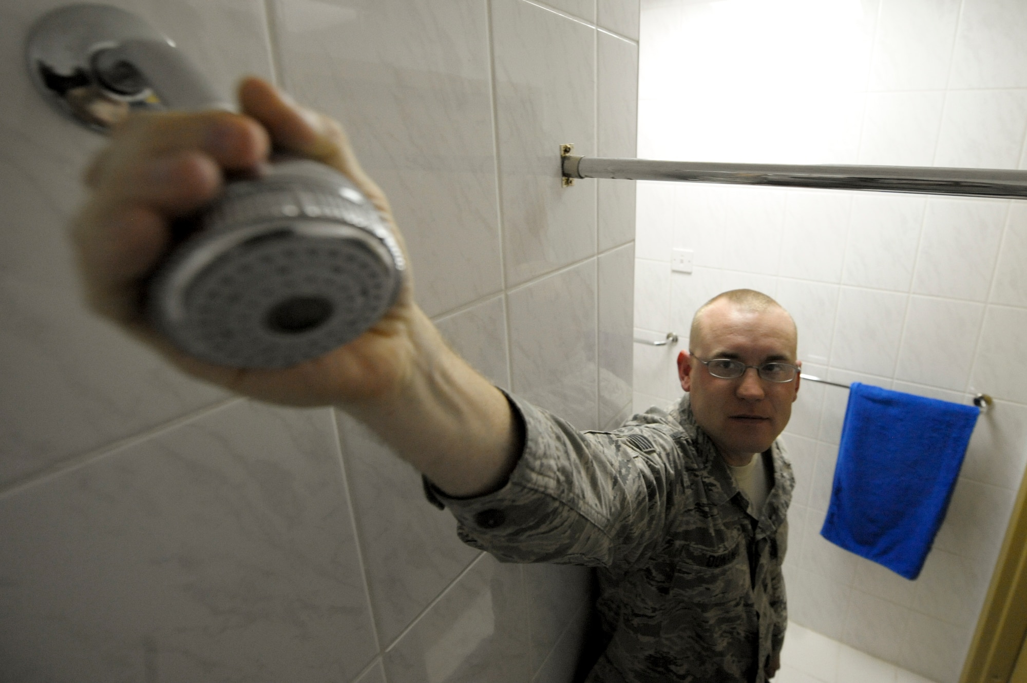 Staff Sgt. Christopher Dunaway, 332nd Expeditionary Civil Engineer Squadron utilities member, checks the shower head of a dorm room at an undisclosed location in Southwest Asia, Mar. 3, 2012. Dunaway and seven members of the 332nd ECES inspected the base living quarters, annotating damage so it can be fixed. Dunaway is deployed from Peterson Air Force Base, Colo., and is a native of Nashville, Tenn. (U.S. Air Force photo by Staff Sgt. Joshua J. Garcia/Released)