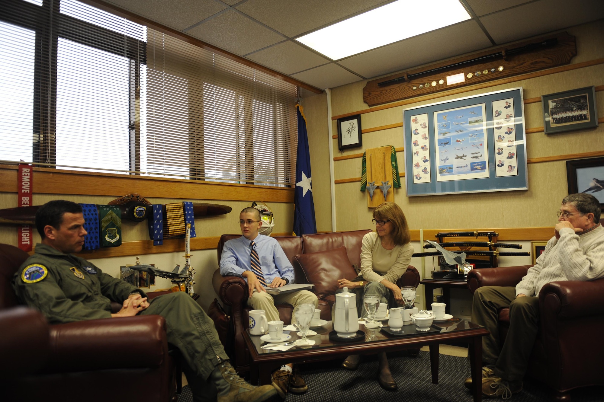 Michael Potts, a 17 year old Kadena High School Senior, sits with his family and U.S. Air Force Brig. Gen. Matthew Molloy, 18th Wing commander, on Kadena Air Base, Feb. 28, 2012. Potts was recently accepted into the Air Force Academy and will be in the academy's smallest class in recent history. (U.S. Air Force photo by Airman 1st Class Brooke P. Beers/Released)