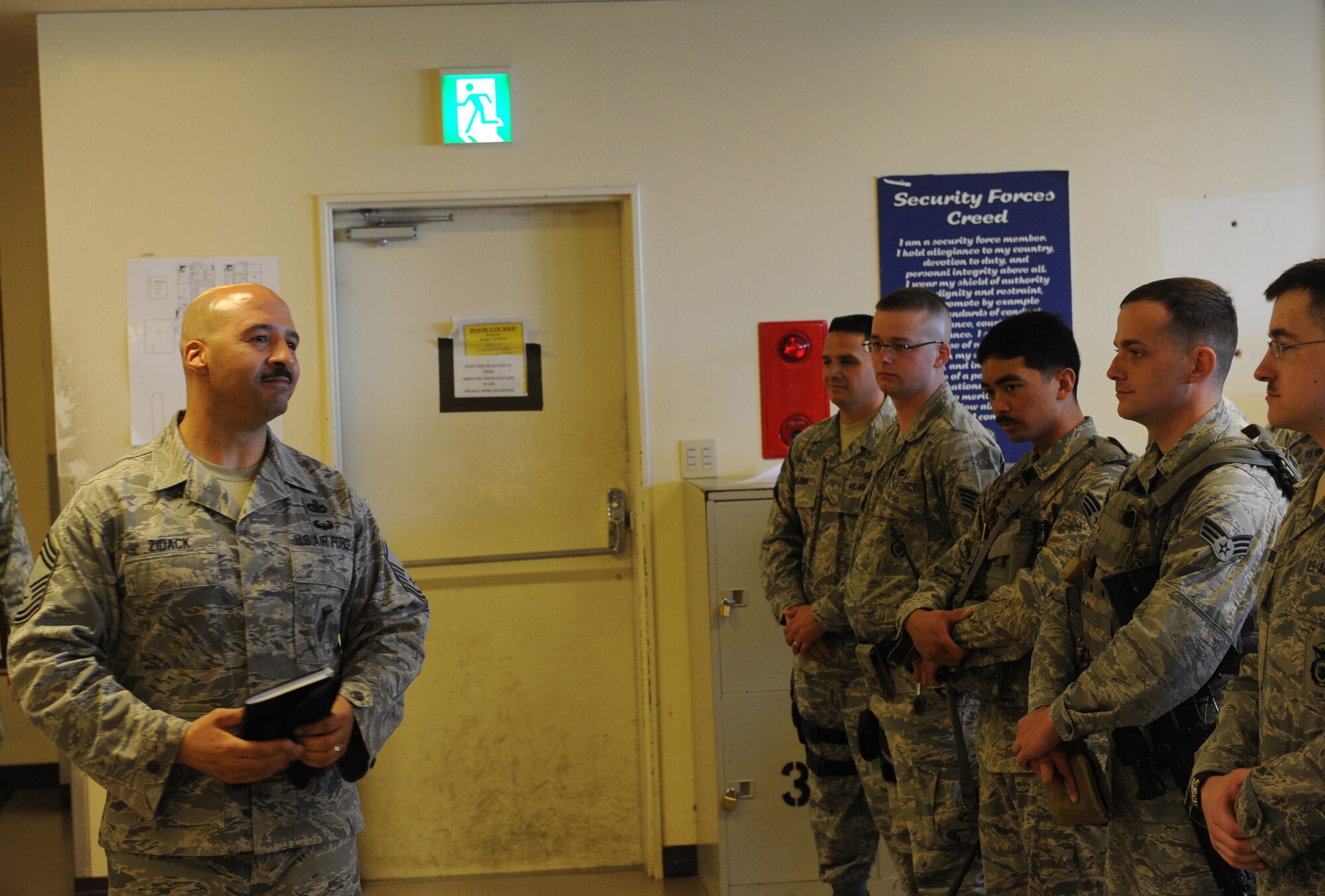 U.S. Air Force Chief Master Sgt. Paul Zidack, Headquarters U.S. Air Force Security Forces Manager, speaks to the Airmen about making the right choices during a visit to Kadena Air Base, Japan, March 5, 2012. Chief Zidack explained to the Airmen some of the new changes that will soon take place within security forces. (U.S. Air Force photo by Airman 1st Class Justin Veazie/released)
