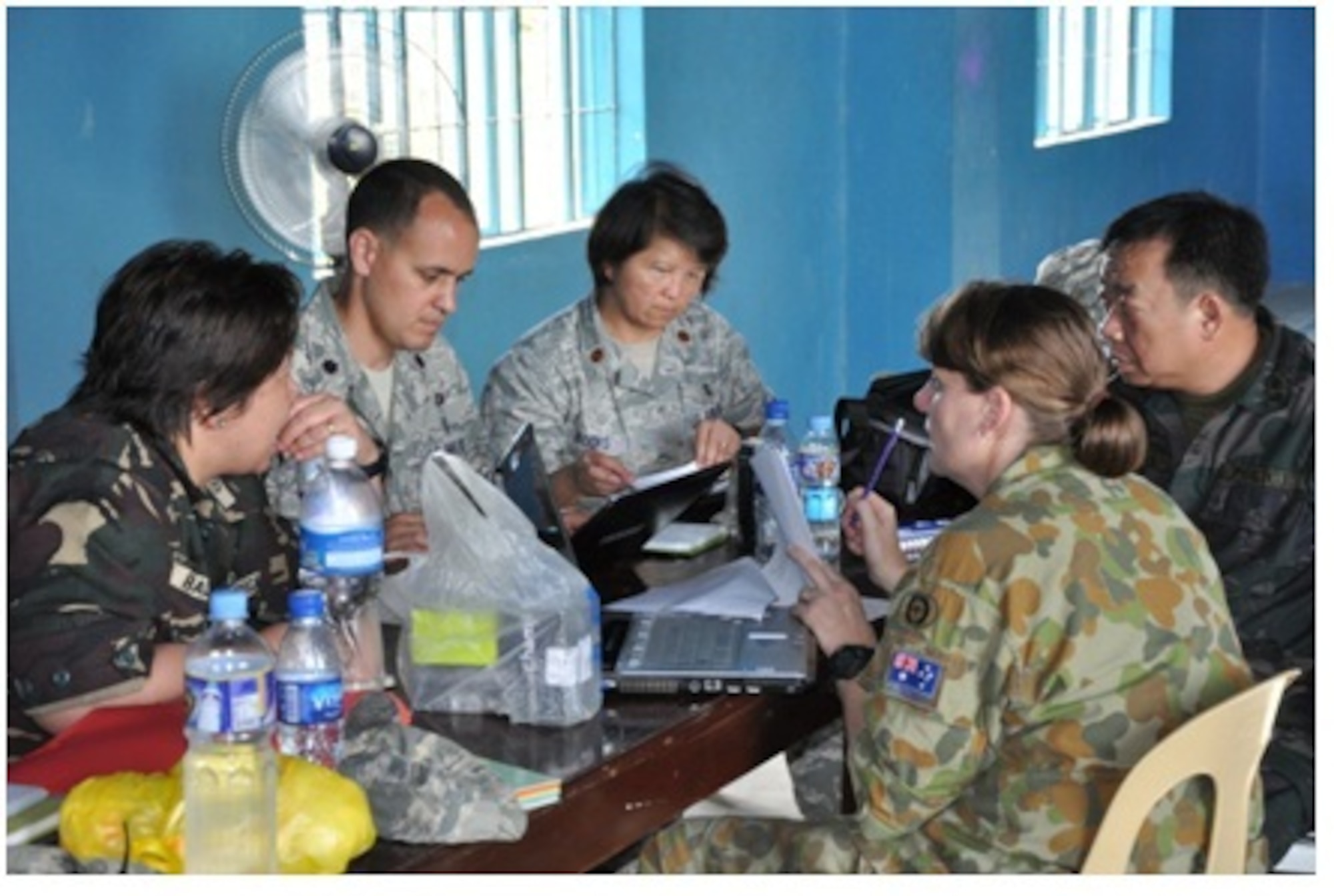 Armed Forces of the Philippines Medical Corps Col. Linda Balaan (left), U.S. Air Force Lt. Col. Timothy Martinez, U.S. Air Force Maj. Nerriza Brooks, Royal Australian Air Force Wing Cmdr. Collette Richards and Philippine National Police Superintendent Rene Zuniga, discuss scheduled medical outreach operations March 1, 2012, at Tactical Operations Group 5, Legazpi City, Philippines. Martinez, Brooks and Richards are medical planners from the 13th Air Force that worked with Philippine medical partners and various non-governmental organizations in preparation for the start of Operation Pacific Angel-Philippines, a joint and combined humanitarian assistance and civil military operations mission scheduled March 5 through 10. (U.S. Air Force photo by 1st Lt. Robert Howard)