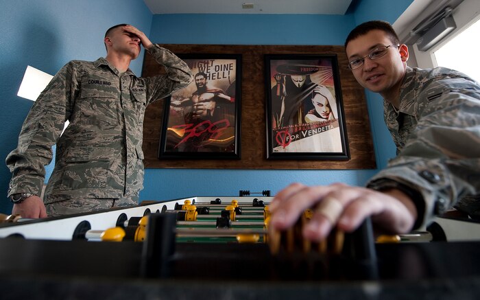 U.S. Air Force Airman 1st Class Matthew Lancaster and Airman 1st Class Jason Couillard, 99th Air Base Wing Still Photographers, play a game of foosball at the Community Center Annex next to the Time Out Sports Lounge February 15th on Nellis Air Force Base, Nev. (U.S. Air Force Photo by Staff Sgt. Chris Hubenthal)