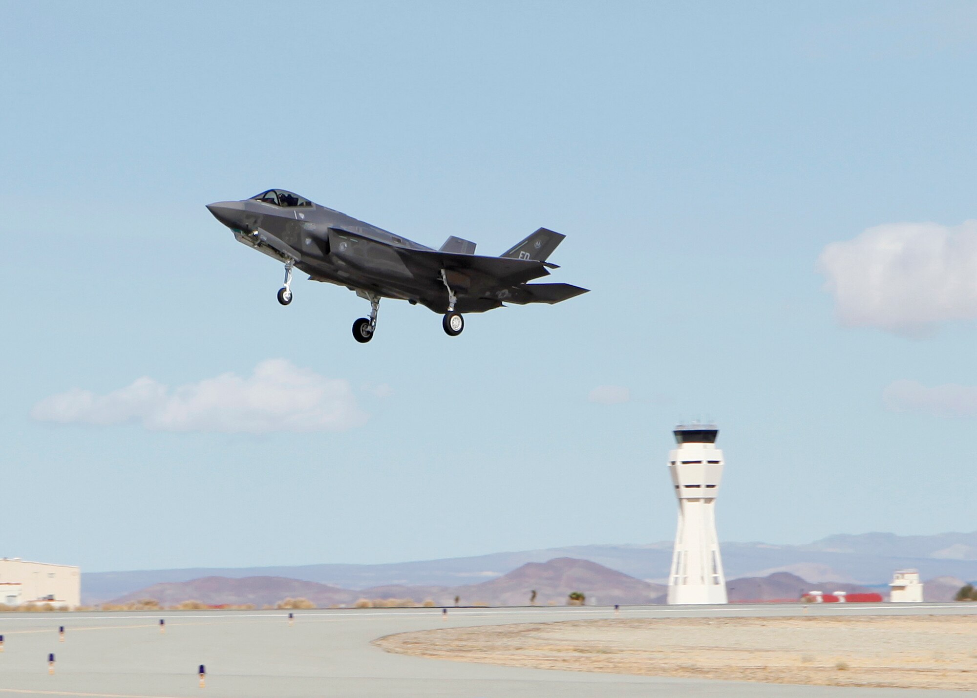 An F-35 Lightning II takes off Runway 22R at Edwards Air Force Base, Calif., in front of Norwegian media and military representatives who were touring the base to learn more about the F-35 and the Joint Strike Fighter program Feb. 29. (U.S. Air Force photo by Jet Fabara)