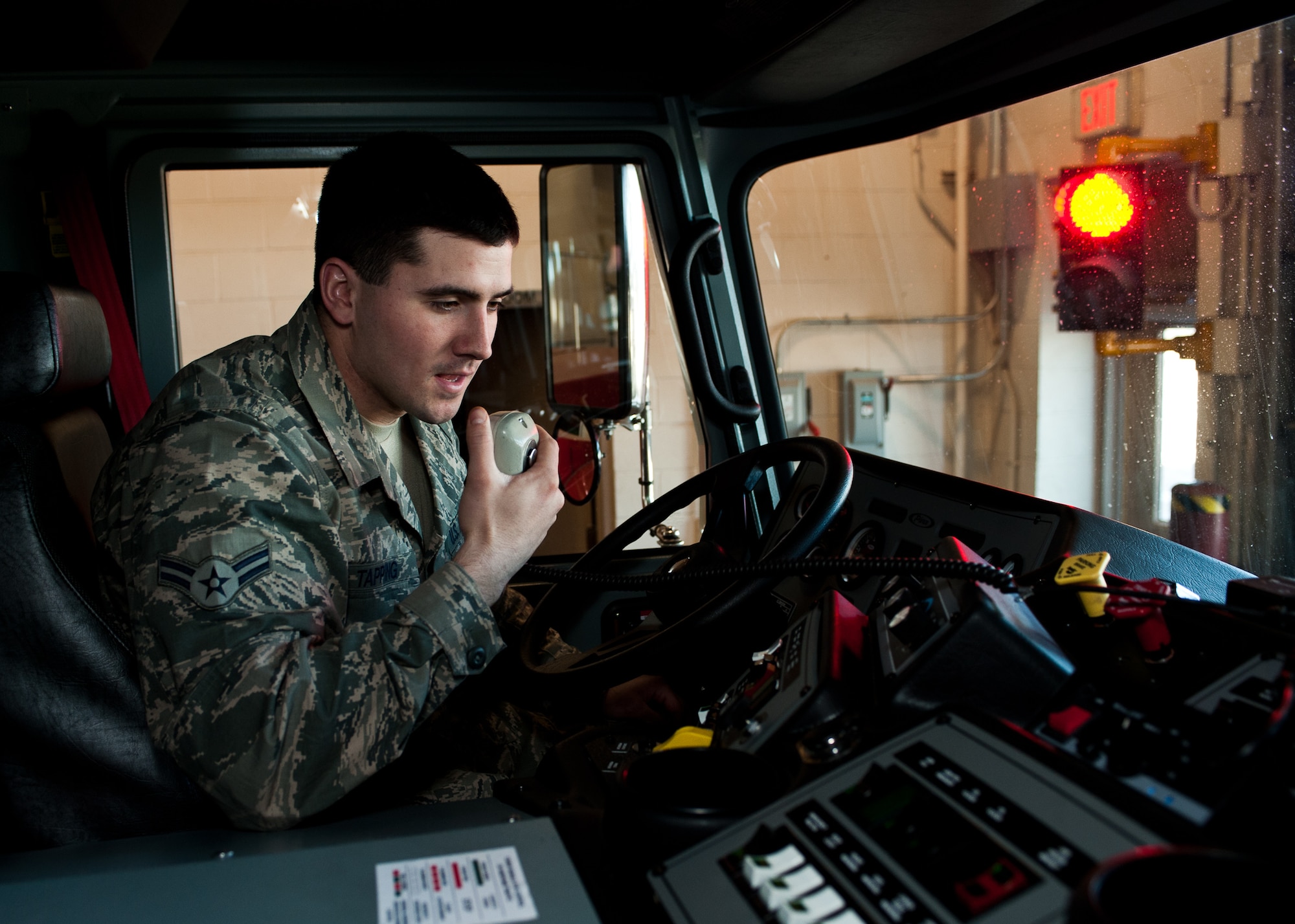 Airman 1st Class Stephen Tapping, 28th Civil Engineer Squadron fire protection apprentice, performs a mobile radio check with the fire station dispatch center at Ellsworth Air Force Base, S.D., March 1, 2012. Every morning communication checks are completed to ensure quick reaction times in response to emergencies. (U.S. Air Force photo by Airman Alystria Maurer/Released)