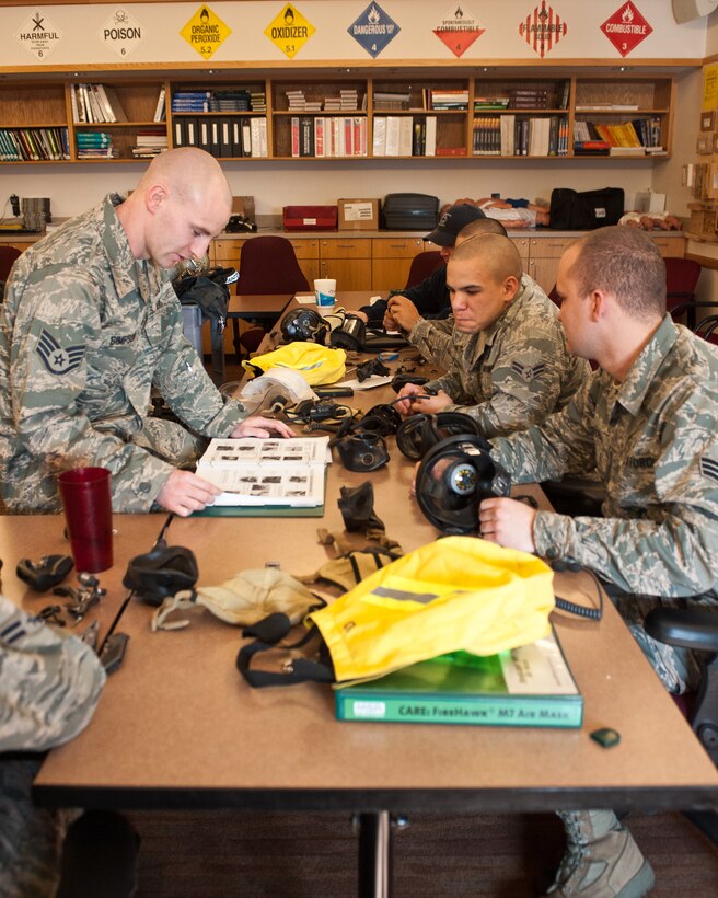 Staff Sgt. Cody Simpson, 28th Civil Engineer Squadron fire suppression driver and operator, teaches a class on self contained breathing apparatus maintenance to Airmen in the 28th CES Fire Safety classroom at Ellsworth Air Force Base, S.D., March 1, 2012. Students are taught how to disassemble, reassemble, functional check and maintain their breathing equipment. (U.S. Air Force photo by Airman Alystria Maurer/Released)