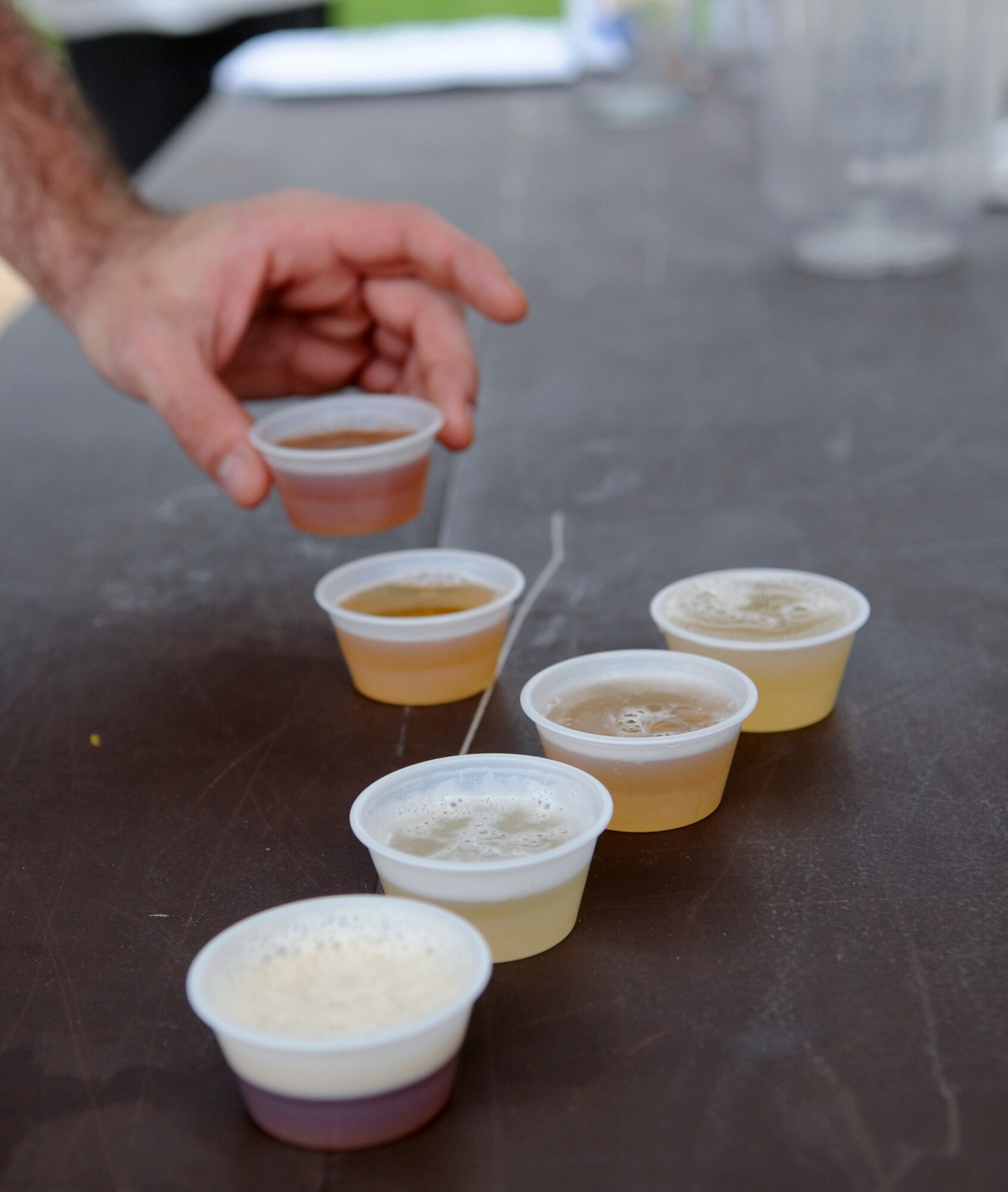 Cups of different beer selections are available for Team Barksdale members to taste during the First Friday Beer and Wine festival at Hangar II on Barksdale Air Force Base, La., March 2. More than 15 beer selections were offered at the event for Barksdale members to taste and rate. Beer with the highest ratings will be added to Hangar II's current selections. (U.S. Air Force photo/Senior Airman Amber Ashcraft)(RELEASED)