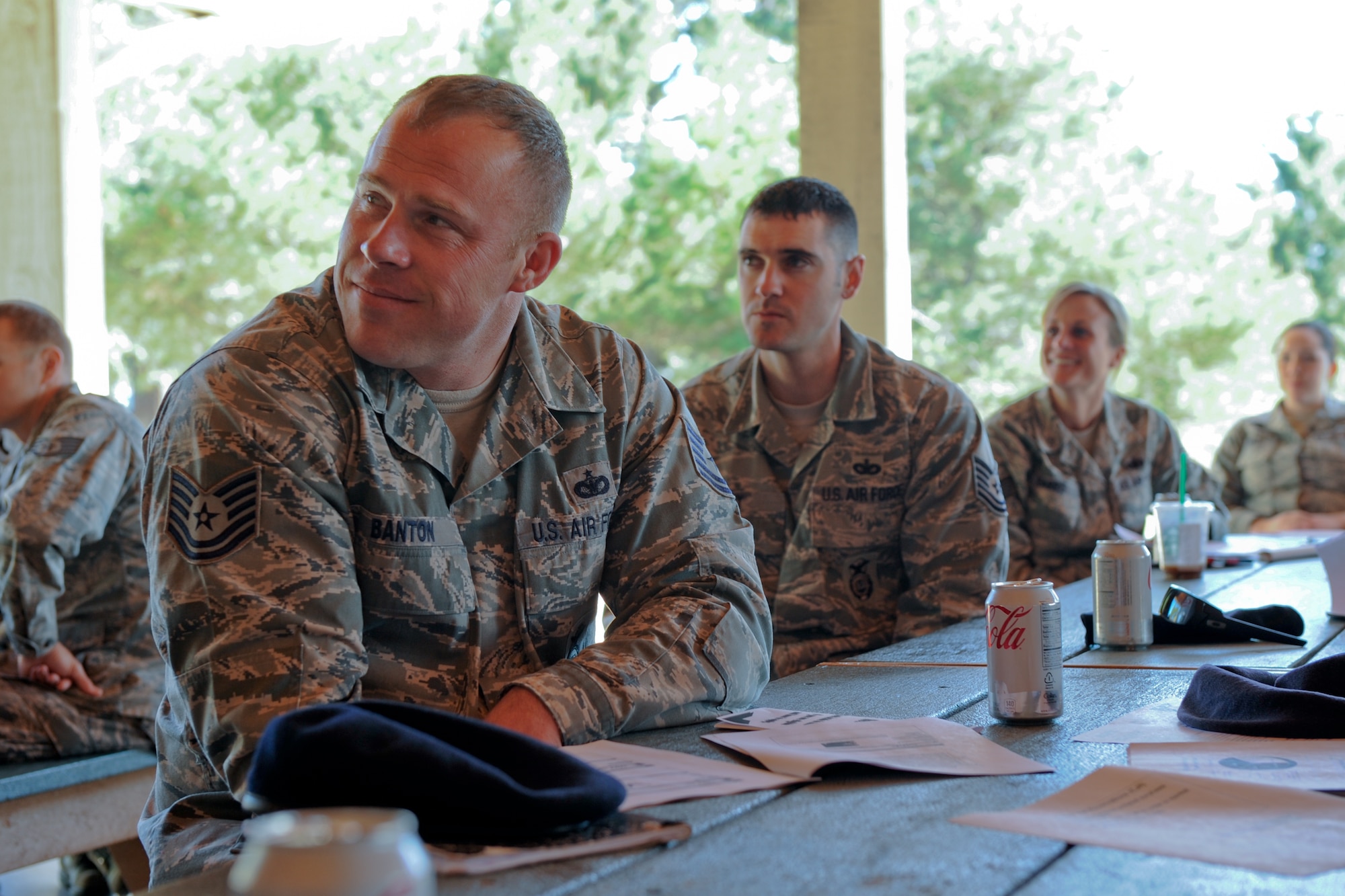 VANDENBERG AIR FORCE BASE, Calif. -- Tech. Sgt. Dave Banton, 30th Security Forces Squadron NCO in charge of operations support, listens to a speaker discuss retraining during a Lunch-and-Learn event at Cocheo Park here Friday, March 2, 2012.  Team V members that attended the event learned how to assist their troops and themselves if they decide to retrain. (U.S. Air Force photo/Staff Sgt. Levi Riendeau)
