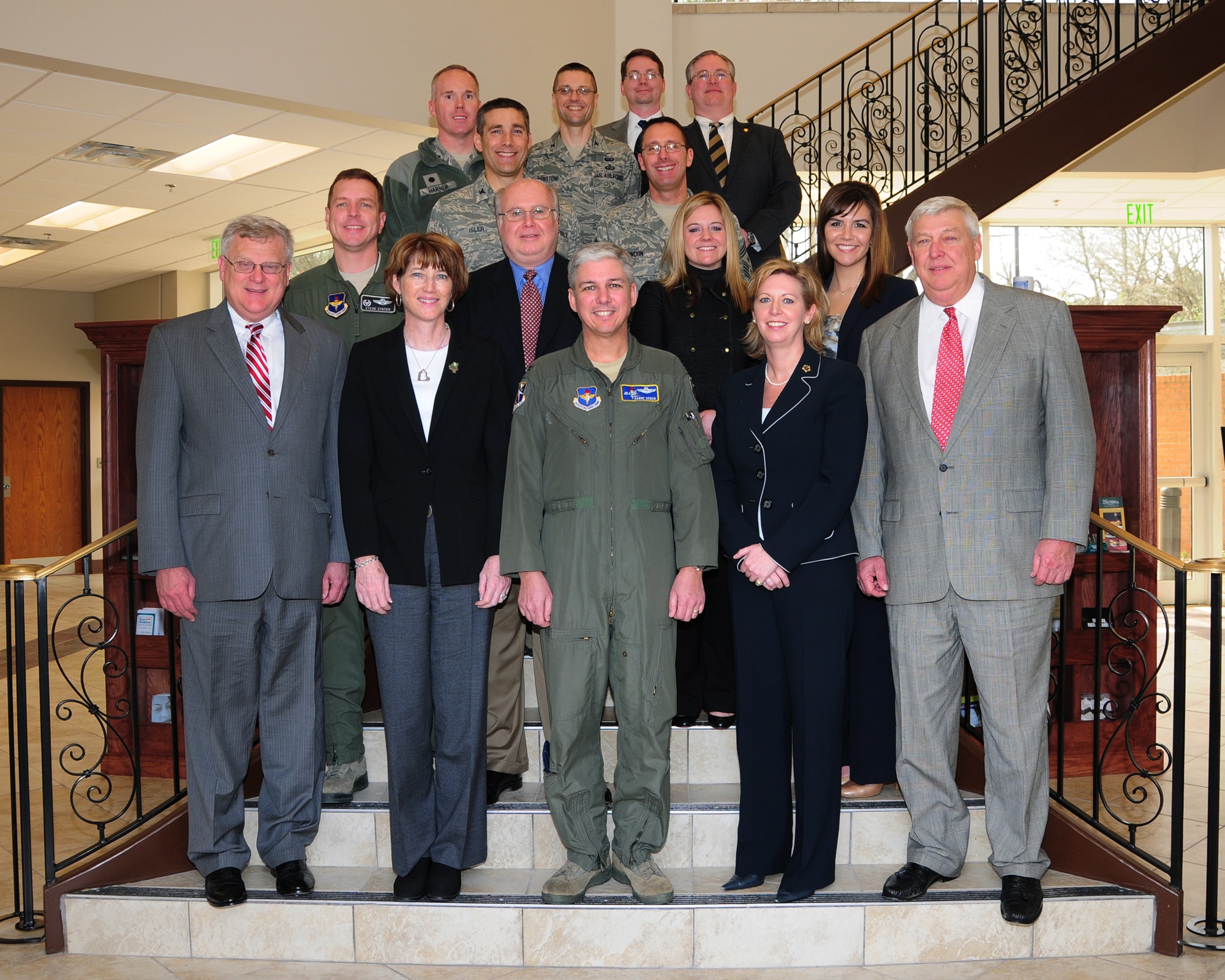 Col. Barre Seguin, 14th Flying Training Wing commander (center) pauses for a photo with Congressman Alan Nunnelee, first congressional district of Mississippi, Kathleen Ferguson, Deputy Assistant Secretary of the Air Force for Installations, Office of the Assistant Secretary of the Air Force for Installations, Environment and Logistics, Sarah Young, House Appropriations Committee staffer, State Senator Terry Brown Mississippi Senator Pro-Tem, members of U.S. Senator Thad Cochran’s staff,  BLAZE senior leaders and members of Mississippi governor Phil Bryant’s staff  toured Columbus AFB Friday Feb. 24.  Ferguson was invited by the Mississippi Congressman Nunnelee to tour Columbus AFB to better understand the complexities of the pilot training mission.