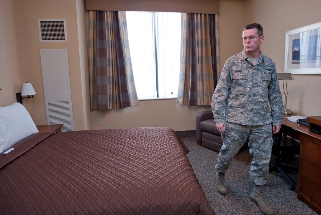 U.S. Air Force Chief Master Sgt. Kevin Howell, 633rd Air Base Wing command chief, tours a model room during the Langley Inn Open House March 2, 2012, at Langley Air Force Base, Va.  The new rooms offer modern décor, queen-sized beds, flat-screen televisions, and other amenities. (U.S. Air Force photo by Senior Airman Stephanie Rubi /Released) 