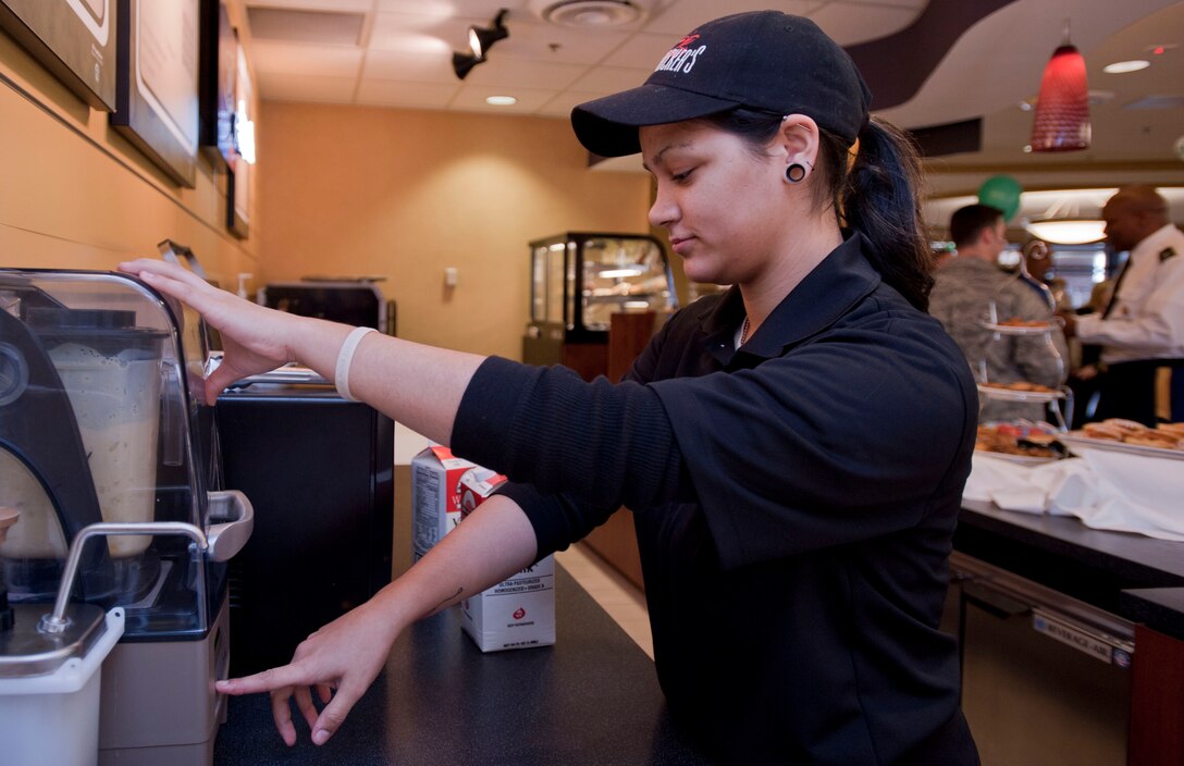 Michelle Aponte, Rickenbacker’s Café barista, blends smoothies for guests at the Langley Inn Open House March 2, 2012, at Langley Air Force Base, Va.   The Langley Inn features a café, wi-fi internet access, and waterfront views.  (U.S. Air Force photo by Senior Airman Stephanie Rubi /Released)