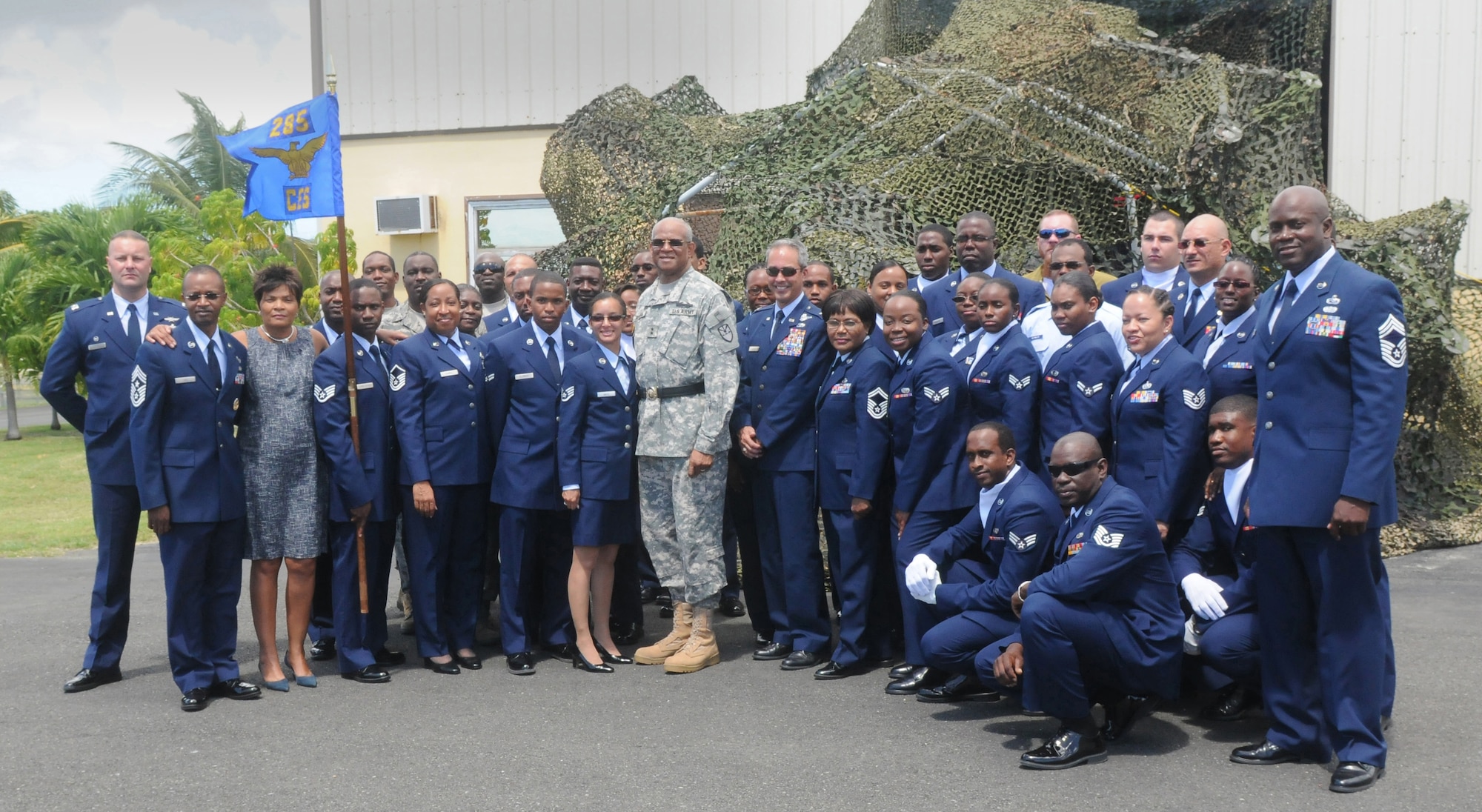 Maj. Gen. Renaldo Rivera, the adjutant general of the Virgin Islands National Guard and past and present unit members of the 285th Civil Engineering Squadron pose for a group shot after its re-designation ceremony at the Virgin Islands Air National Guard facility, Manning Hill, St. Croix, Mar. 3. The unit, formerly known as the 285th Combat Communications Squadron, transitioned from a communications unit to a rapidly deployable engineer unit. The Virgin Islands Air National Guard recently celebrated its 32nd birthday in February.  (VING photo by Sgt. Juanita Philip-Mathurin) 
