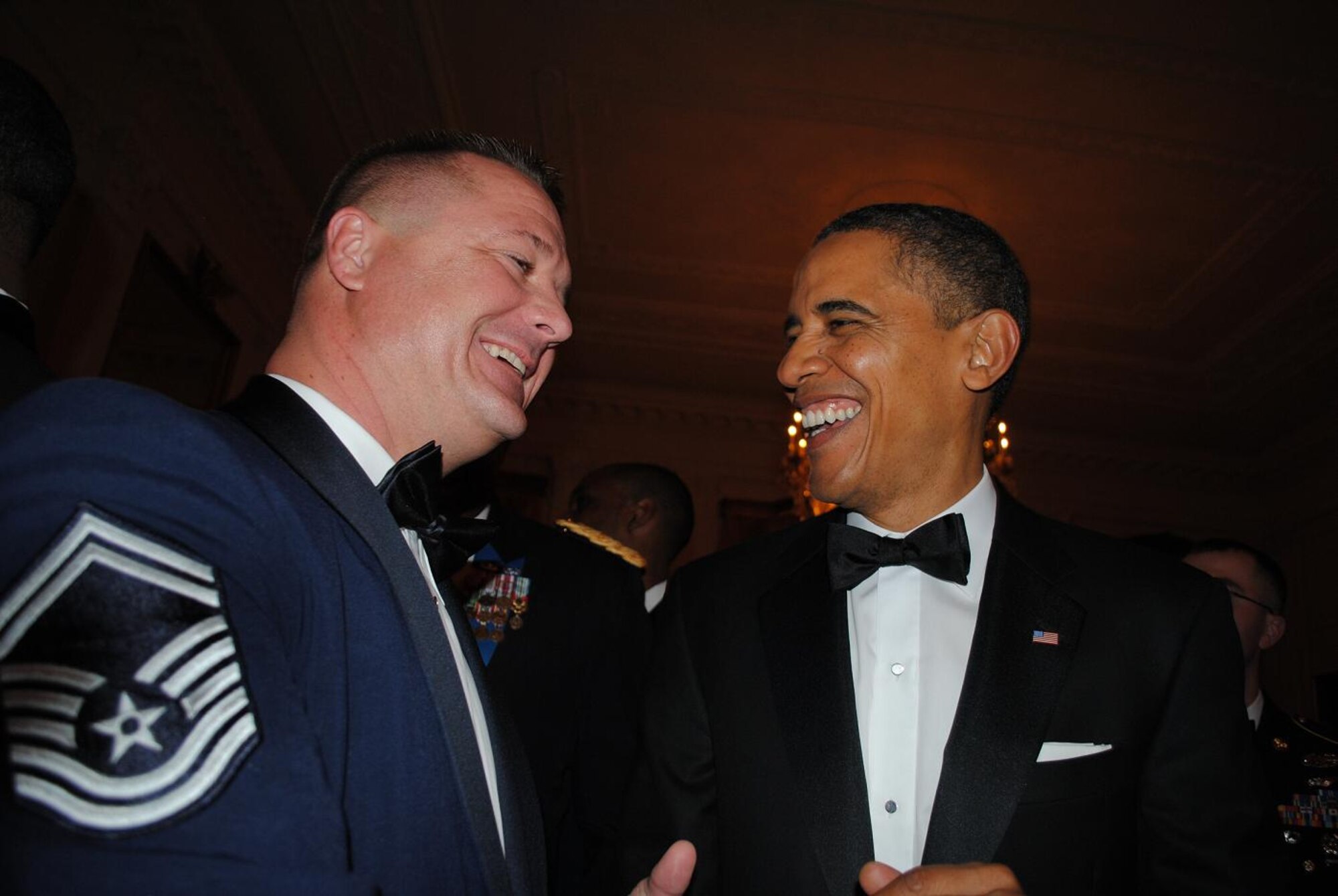 Senior Master Sgt. Donnie Bolton, 21st Security Forces Squadron, shares a laugh with President Barack Obama Feb. 29 at The White House. Bolton and other service members representing the 50 states were invited to the White House for a dinner dubbed "A Nation's Gratitude: Honoring Those Who Served in Operation Iraqi Freedom and Operation New Dawn." (Courtesy photo)