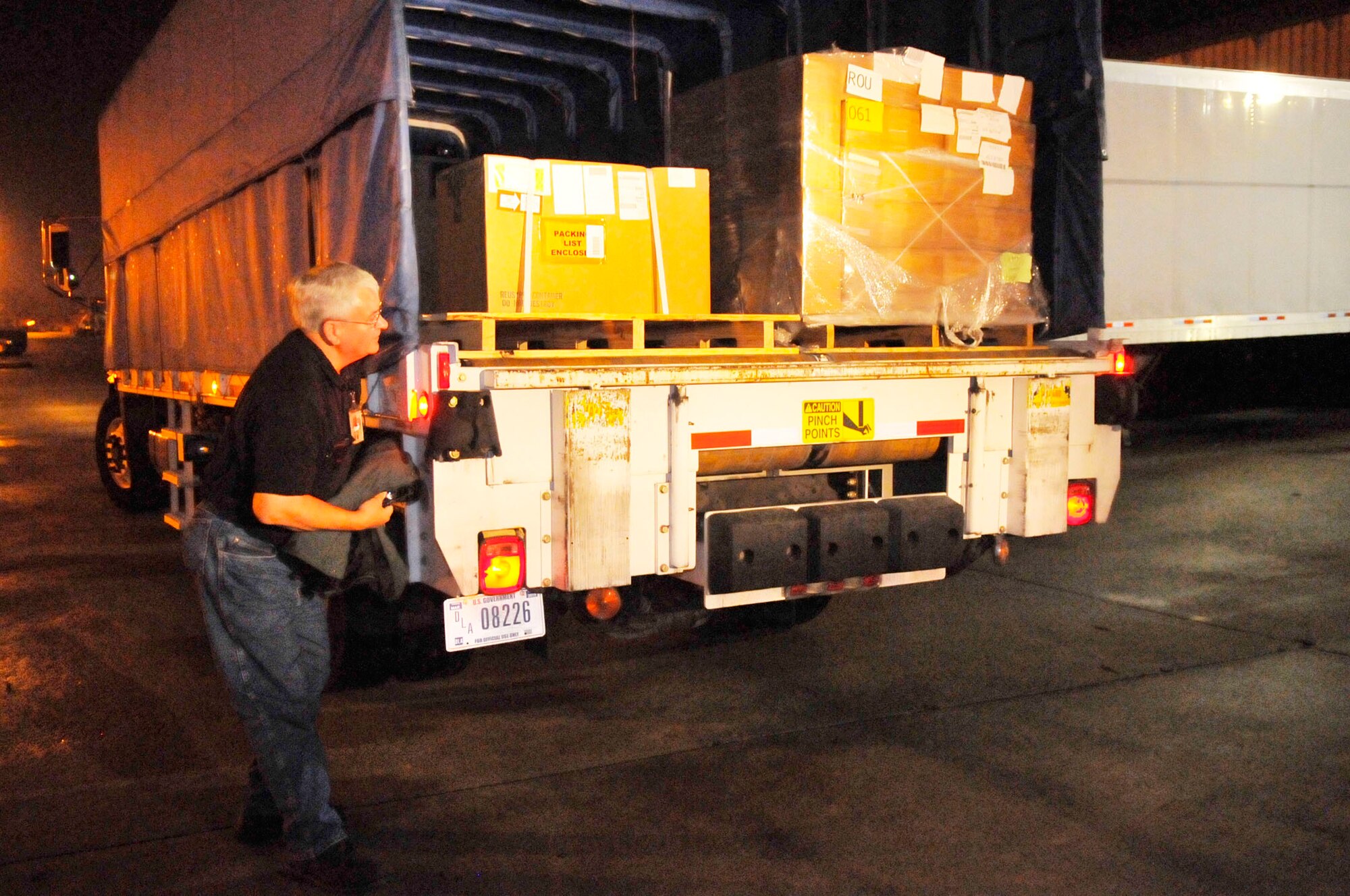 Robert Cleveland, Defense Logistics Agency, prepares to unload a truck during the early morning hours. (U.S. Air Force photo by Sue Sapp)