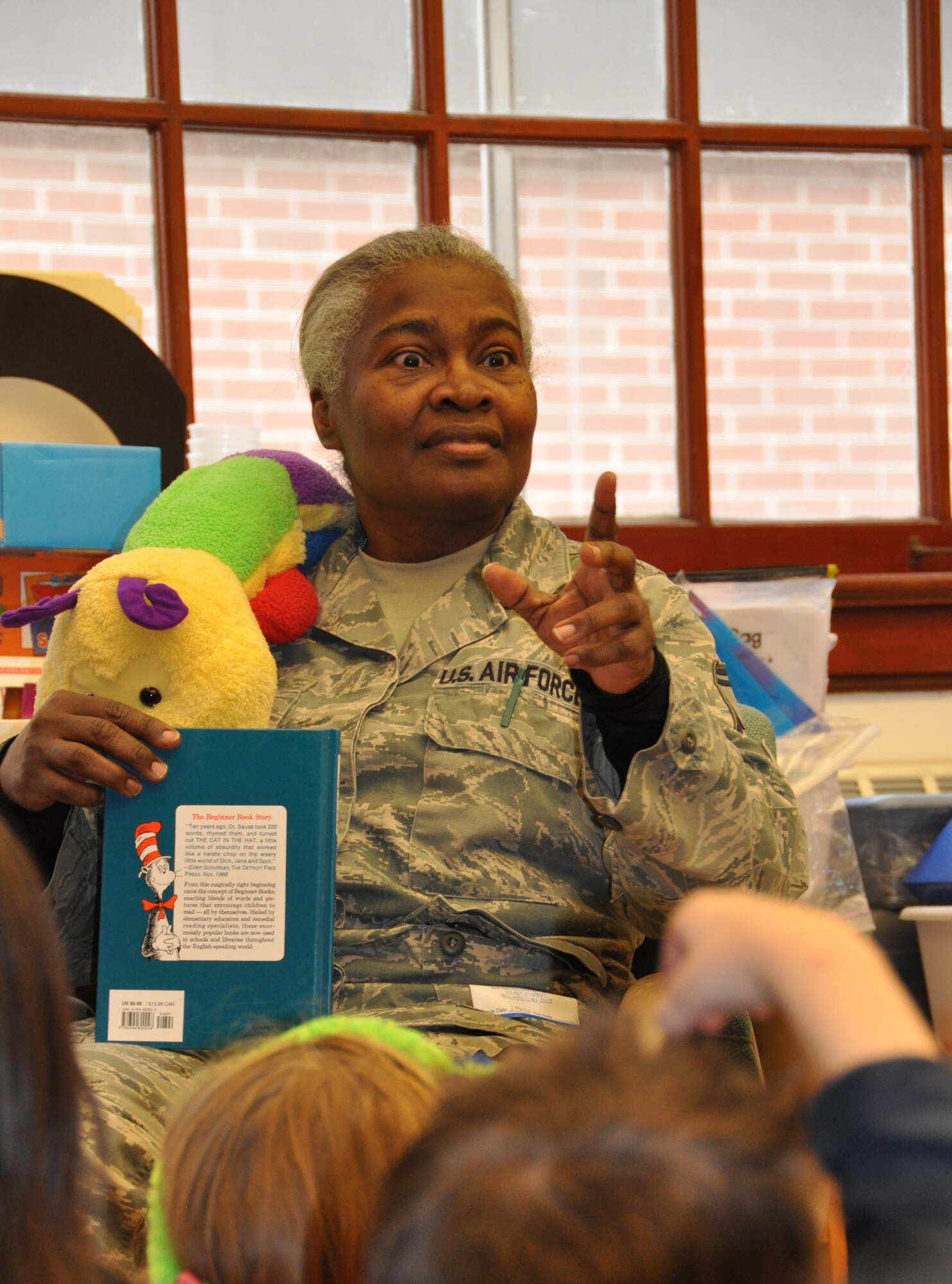 JOINT BASE MCGUIRE-DIX-LAKEHURST, N.J. - Senior Master Sgt. Amy Miller is one of several Reserve Airmen who volunteered March 2 to read to students at New Hanover School in Wrightstown, N.J as part of Read Across America; a nationwide reading celebration that takes place annually on Dr. Seuss’s birthday. (U.S. Air Force photo/Master Sgt. Donna T. Jeffries)