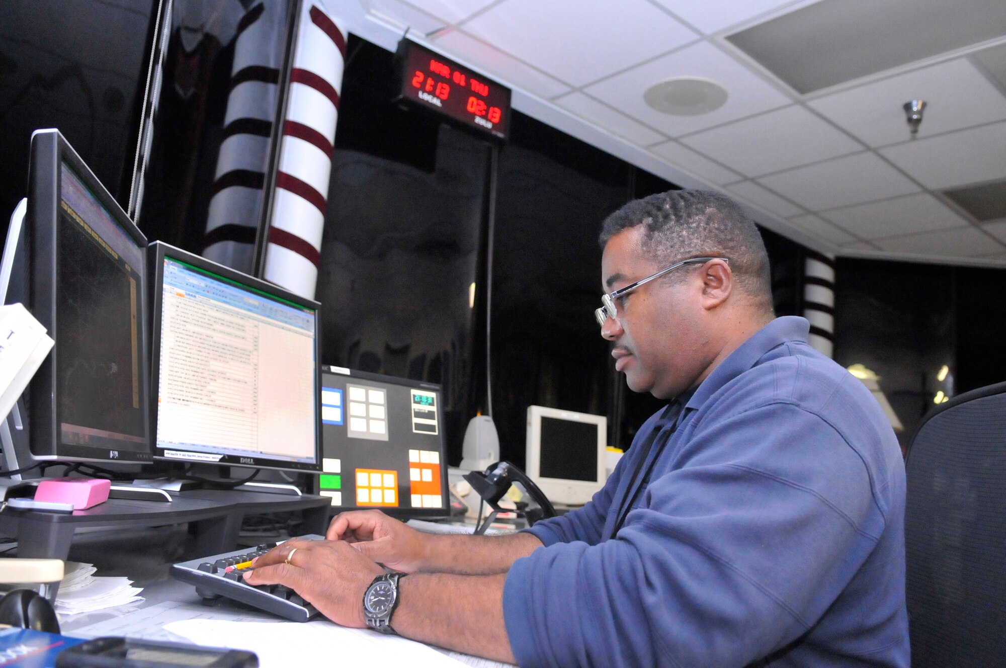 Willie Williams works the swing shift at Base Operations, which is manned 24 hours a day. (U. S. Air Force photo by Sue Sapp)