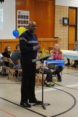 Lt. Col. Clyde Dyson, 341st Missile Wing chaplain, speaks to the audience of the Blue and Gold ceremony held at Chief Joseph Elementary Feb. 24.  (U.S. Air Force photo/Airman 1st Class Cortney Paxton)
