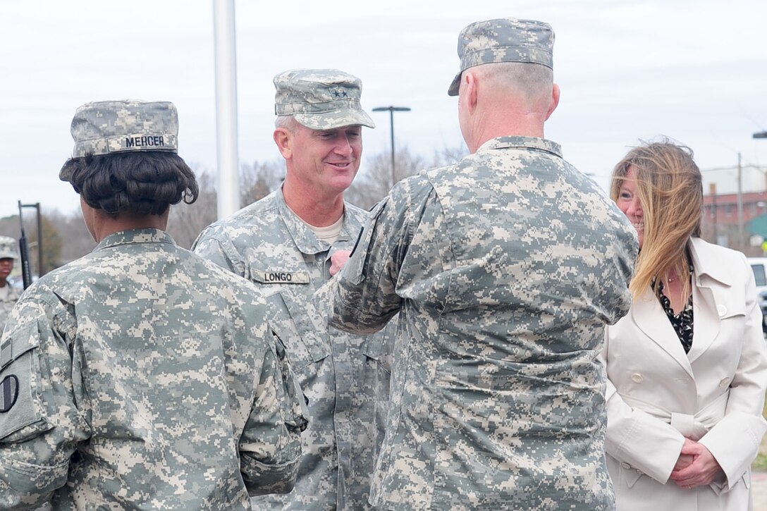 Maj. Gen. Richard C. Longo, former deputy commanding general of Initial Military Training Center of Excellence, receives the Legion of Merit during a change of responsibility ceremony at the U.S. Army Training and Doctrine Command Headquarters, Fort Eustis, Va., March 2, 2012. Maj. Gen. Bradley W. May assumed responsibilities as DCG-IMT. (U.S. Air FOrce photo by Staff Sgt. Ashley Hawkins/Released)