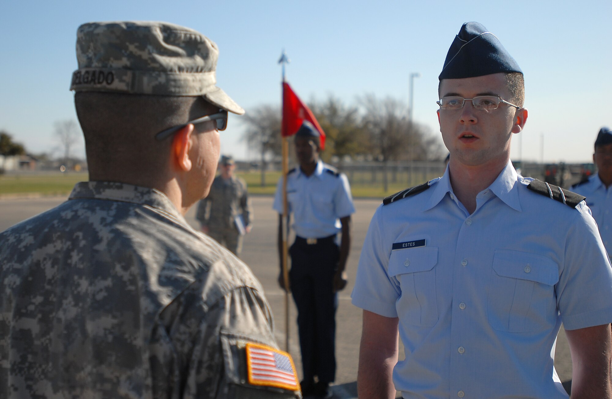 GOODFELLOW AIR FORCE BASE, Texas -- Sgt. 1st Class Michael Delgado, 344th Military Intelligence Battalion, Inspects Angelo State University Reserve Officer Training Corps Cadet Brett Estes, "A" Flight Commander, during an open ranks inspections March 3, here. The ROTC cadets were inspected by surprise guest inspectors consisting of Marine Corps and Army NCO's. (U.S. Air Force photo/Airman 1st Class Michael Smith)