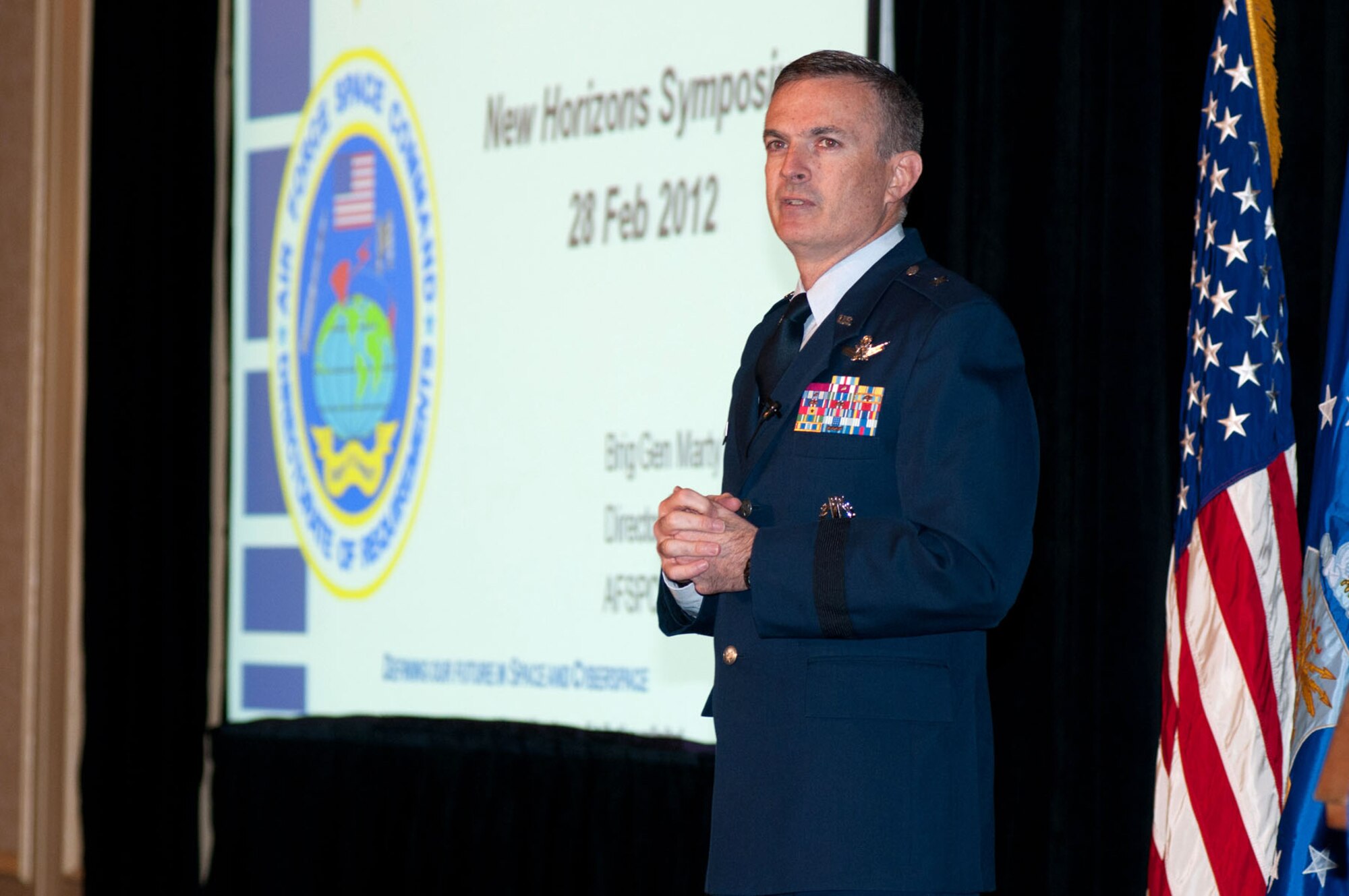 NEWTON, Mass. - Brig. Gen. Martin Whelan, Air Force Space Command Requirements director, speaks during the New Horizons Symposium at the Marriott Hotel Feb. 28. During his brief on the "Warfighter View," Whelan said that AFSPC is looking for innovative solutions. 