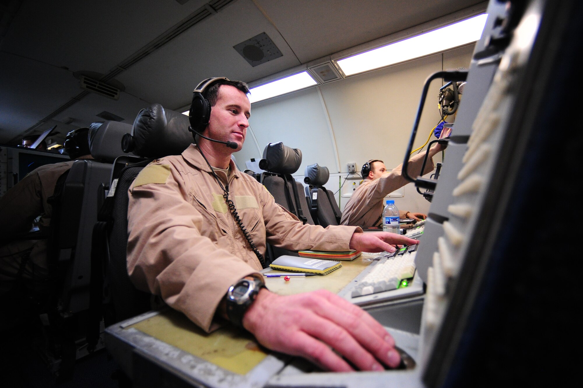 U.S. Air Force E-3 Sentry air surveillance officer Maj. Bill McRaven of San Diago,  Calif., monitors his equipment during a combat support operation over Afghanistan March 1, 2012. McRaven is deployed to the 964th Expeditionary Airborne Air Control Squadron. The E-3 Sentry is an airborne warning and control system, or AWACS, that provides situational awareness of friendly, neutral and hostile activity, command and control of an area of responsibility, battle management of theater forces, all-altitude and all-weather surveillance of the battle space, and early warning of enemy actions during joint, allied, and coalition operations. (U.S. Air Force photo/ Tech. Sgt. DeNoris A. Mickle/Released)
