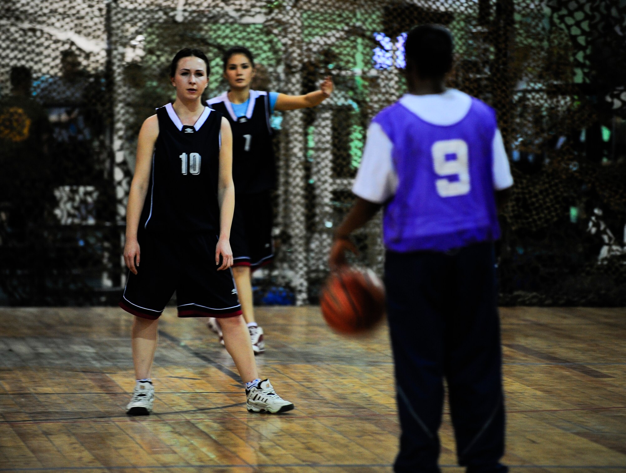 Olga Bagreva prepares for her opponent March 3, 2012, during a Kyrgyz and American friendship basketball game to celebrate International Women's Day at the Transit Center at Manas, Kyrgyzstan. Bagreva is a team member of the Kyrgyz-Russian Slavic University women's basketball team. The Transit Center team won 68-60 in overtime. (U.S. Air Force Photo/Staff Sgt. Angela Ruiz)