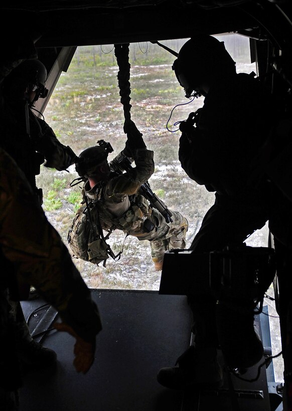 Soldiers fast rope from an Air Force CV-22 Osprey aircraft during ...