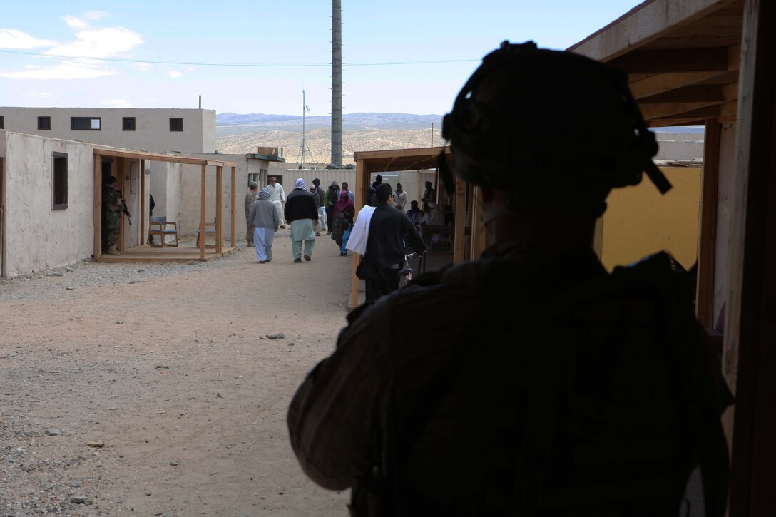 A Marine with 1st Marine Special Operations Battalion, U.S. Marine Corps Forces, Special Operations Command, provides security during a medical engagement as part of a pre-deployment exercise on Fort Irwin, Calif. May 15, 2011. The three-week exercise is designed to prepare MARSOC Marines for deployment to combat operations in Afghanistan by immersing them in an environment as realistic and comprehensive as possible. (Official U.S. Marine Corps photo by  Cpl. Kyle McNally/Released)