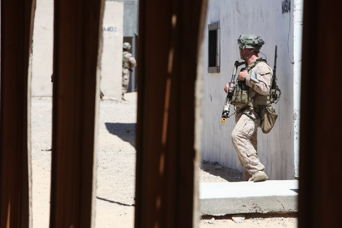 Marines with U.S. Marine Corps Forces, Special Operations Command, provide security during a medical engagement as part of a pre-deployment exercise at the National Training Center, Fort Irwin, Calif., May 15. The three-week exercise is designed to prepare MARSOC Marines for deployment to combat operations in Afghanistan by immersing them in an environment as realistic and comprehensive as possible.
