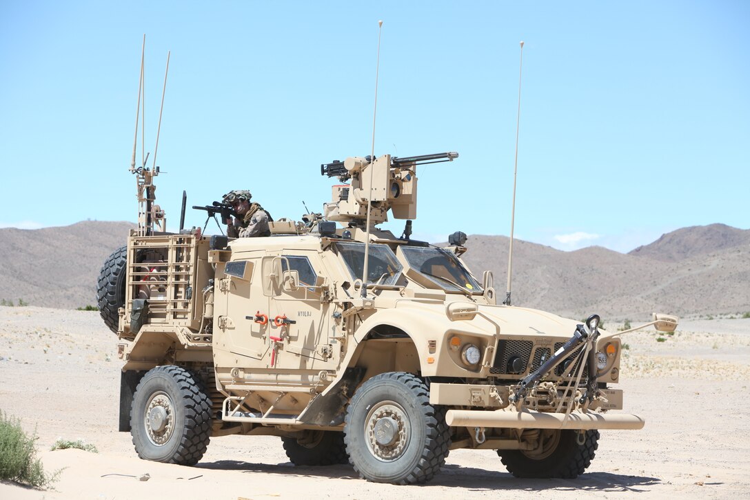 A Marine sniper with U.S. Marine Corps Forces, Special Operations Command, provides security from the back of an M-ATV during a medical engagement as part of a pre-deployment exercise at the National Training Center, Fort Irwin, Calif., May 15. The three-week exercise is designed to prepare MARSOC Marines for deployment to combat operations in Afghanistan by immersing them in an environment as realistic and comprehensive as possible.