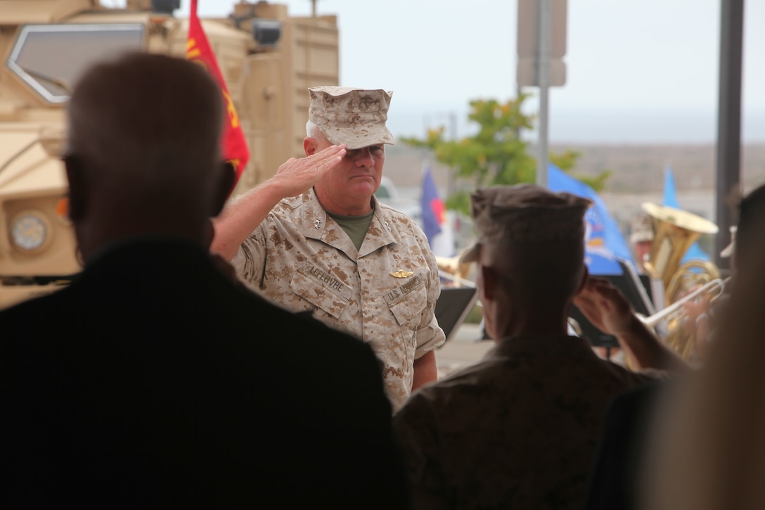 Maj. Gen. Paul E. Lefebvre, commander of U.S. Marine Corps Forces, Special Operations Command, renders a salute during the playing of the National Anthem at a memorial dedication ceremony aboard Camp Pendleton, Calif. Sept. 16, in which a monument dedicated to 1st Marine Special Operations Battalion's fallen warriors was unveiled. September was a month of rememberance and reflection, marked by several ceremonies taking place throughout MARSOC to honor its fallen servicemembers and the victims of 9/11.