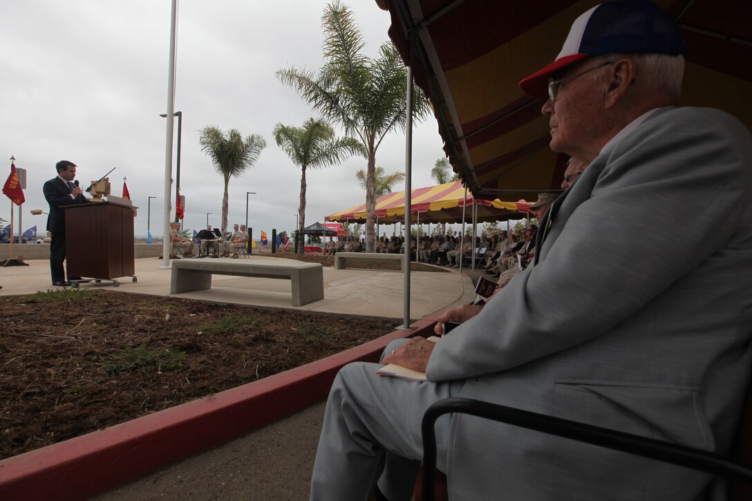 World War II veteran and retired U.S. Marine Raider Chuck Meacham (right) listens to a guest speaker at a memorial dedication ceremony aboard Camp Pendleton, Calif. Sept. 16, in which a monument dedicated to 1st MSOB's fallen warriors was unveiled. September was a month of rememberance and reflection, marked by several ceremonies taking place throughout MARSOC to honor its fallen servicemembers and the victims of 9/11. 