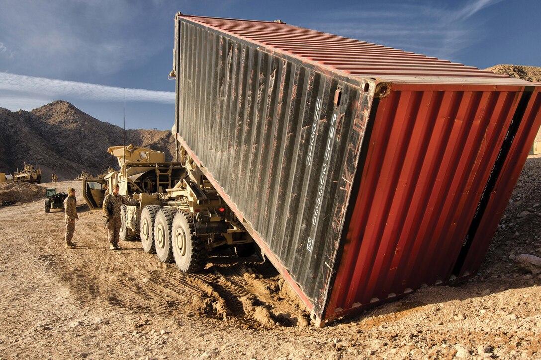 CLB-4 Marines unload supplies using a palletized loading system on FOB Whitehouse Feb. 15. CLB-4 is attached to 1st Marine Logistics Group (Forward).