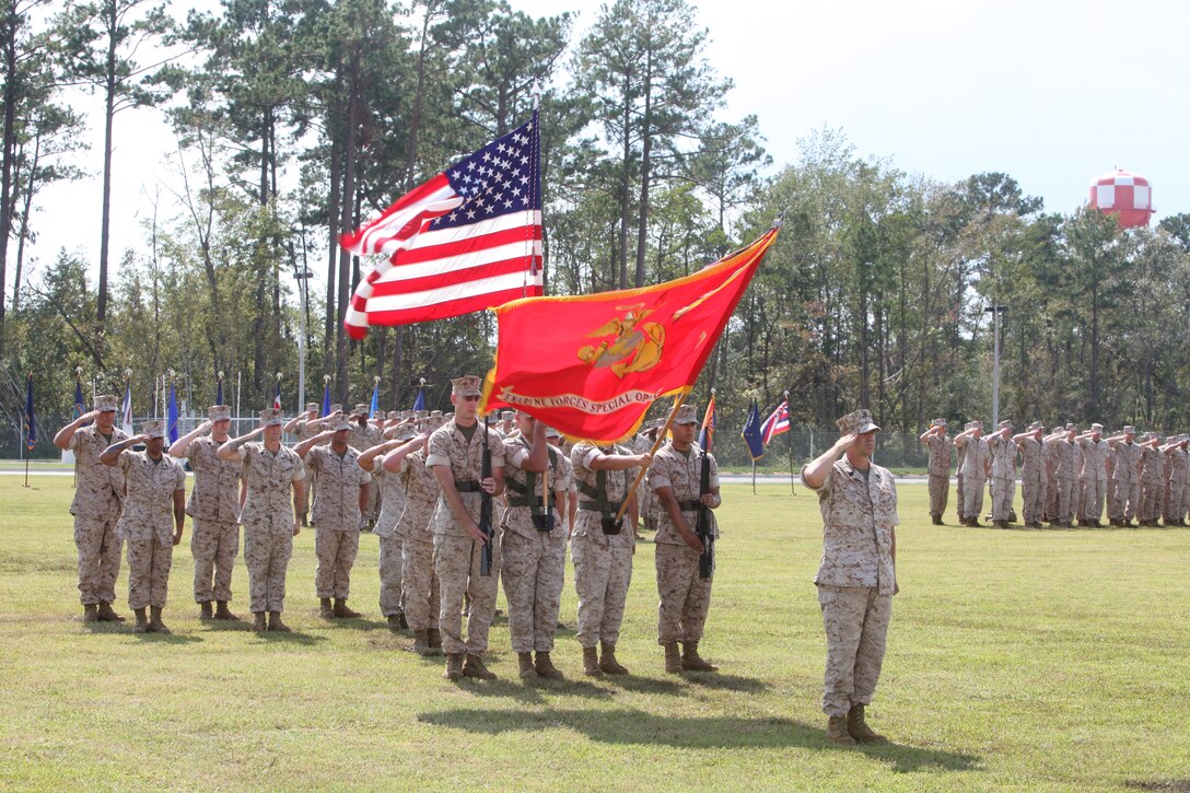 Sgt. Maj. Richard W. Ashton, former sergeant major of U.S. Marine Corps Forces, Special Operations Command, renders a salute during the playing of the National Anthem at a post and relief ceremony aboard Camp Lejeune, N.C. Sept. 30. As Sgt. Maj. Thomas F. Hall prepares to take the reins as MARSOC's top senior-enlisted, Ashton is retiring after 32 years of service.