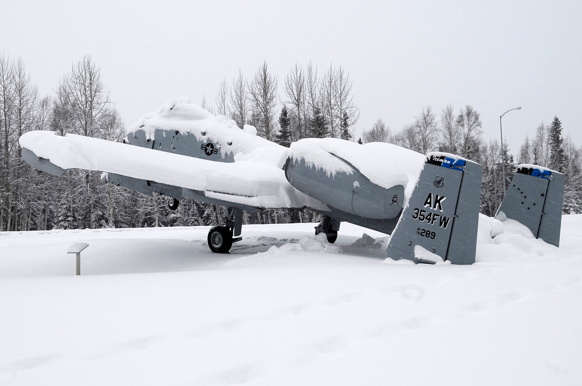 An A-10 Thunderbolt static display at Heritage Park tips backward from the weight of snow on its tail March 6, 2012, Eielson Air Force Base, Alaska. Average snowfall for March usually exceeds 7 inches each year. (U.S. Air Force photo/Staff Sgt. Jim Araos)