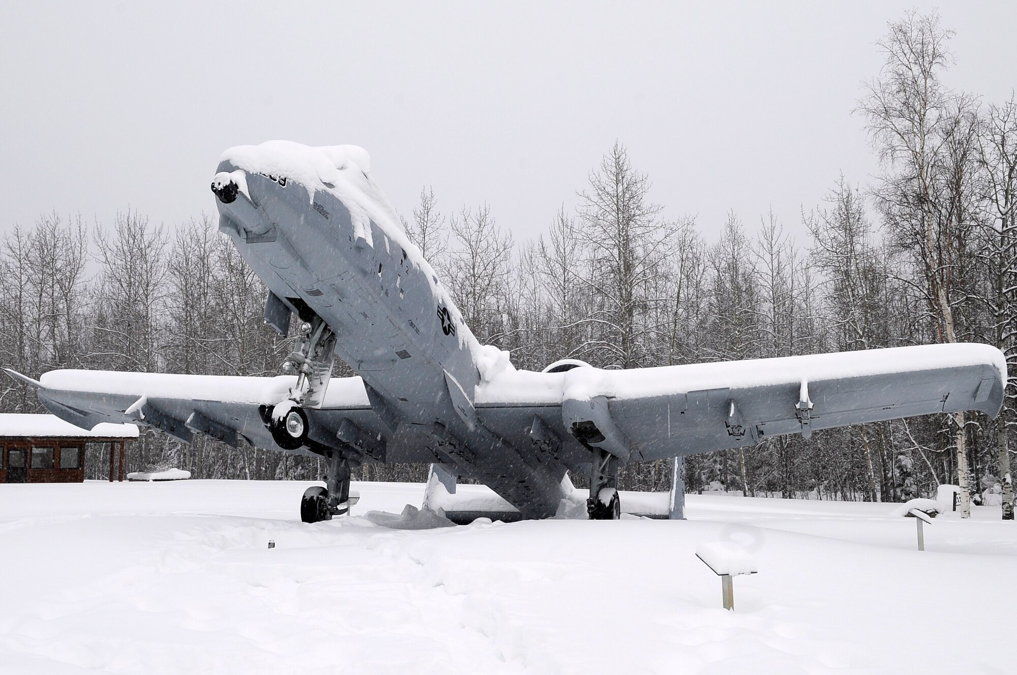 An A-10 Thunderbolt static display at Heritage Park tips backward from the weight of snow on its tail March 6, 2012, Eielson Air Force Base, Alaska. Eielson received more than 8 inches of snow in the past week. (U.S. Air Force photo/Staff Sgt. Jim Araos)