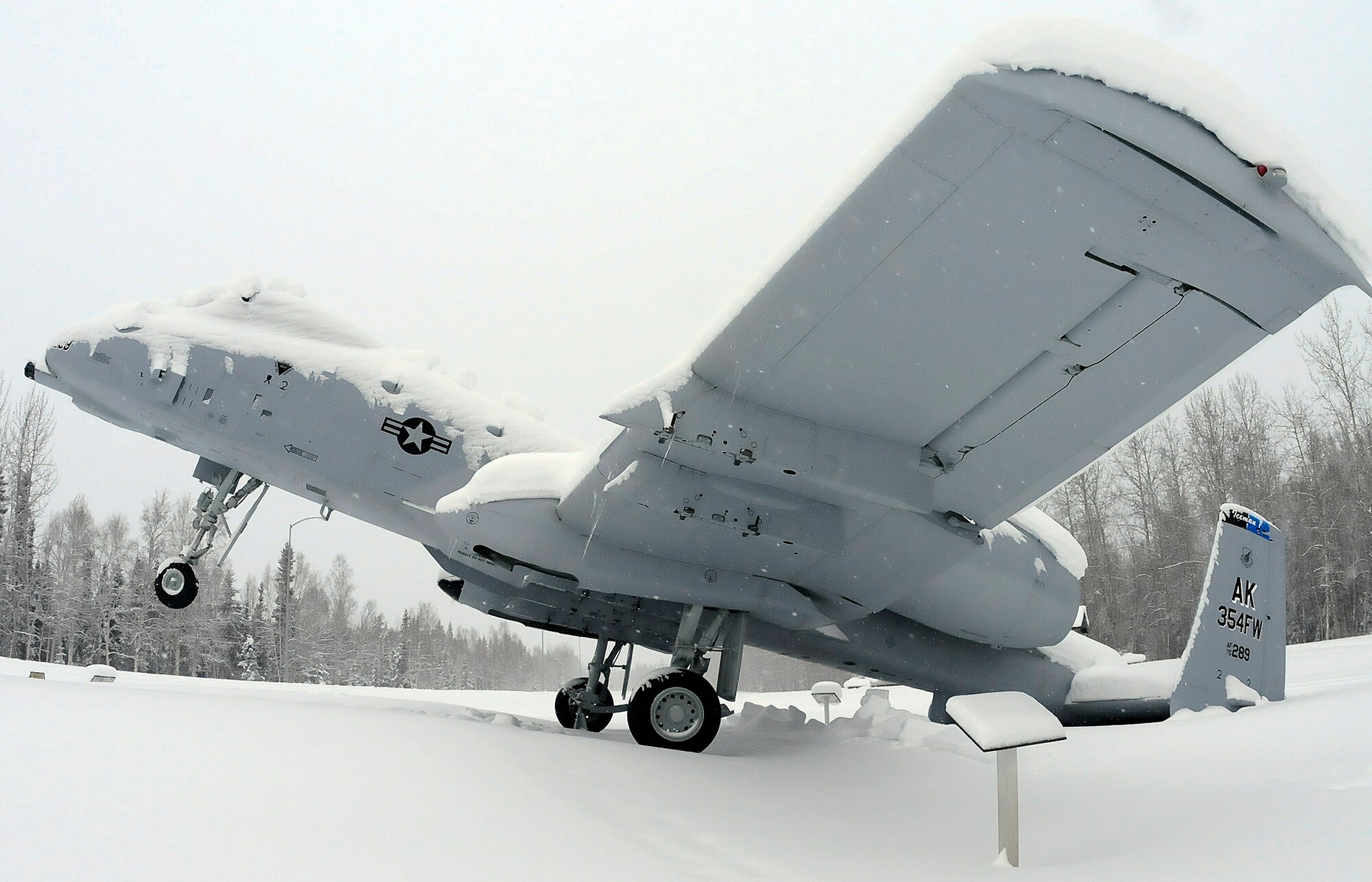 An A-10 Thunderbolt static display at Heritage Park tips backward from the weight of snow on its tail March 6, 2012, Eielson Air Force Base, Alaska. Eielson received more than 8 inches of snow in the past week. (U.S. Air Force photo/Airman 1st Class Zachary Perras) 