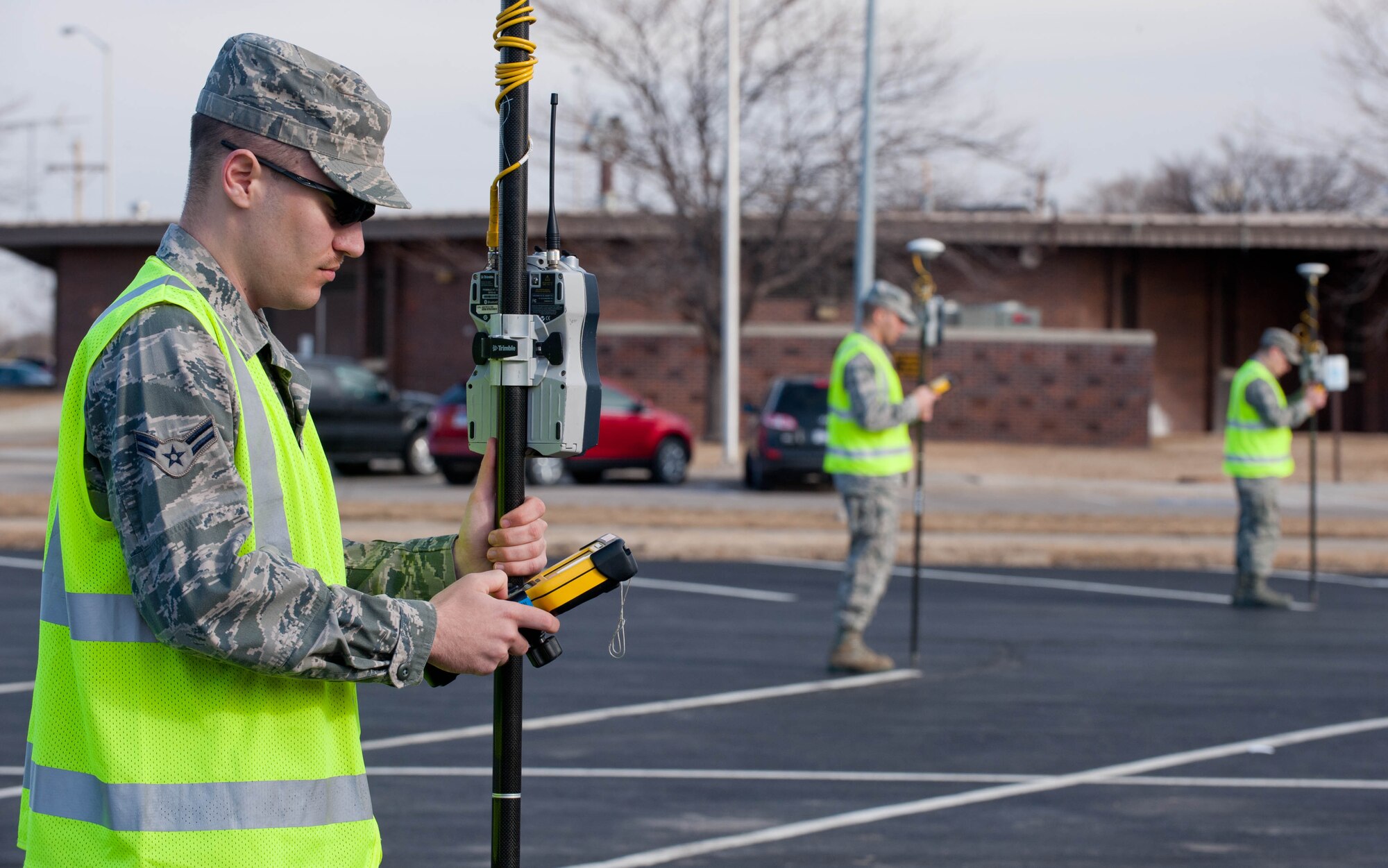 Airman 1st Class Michael Rusnak, 28th Civil Engineer Squadron survey chief, leads a team of survey technicians to collect information during base mapping at Ellsworth Air Force Base, S.D., March. 6, 2012. Survey technicians are responsible for collecting data in the field, making calculations and helping with computer-aided drafting of base maps. (U.S. Air Force photo by Airman 1st Class Zachary Hada/Released)