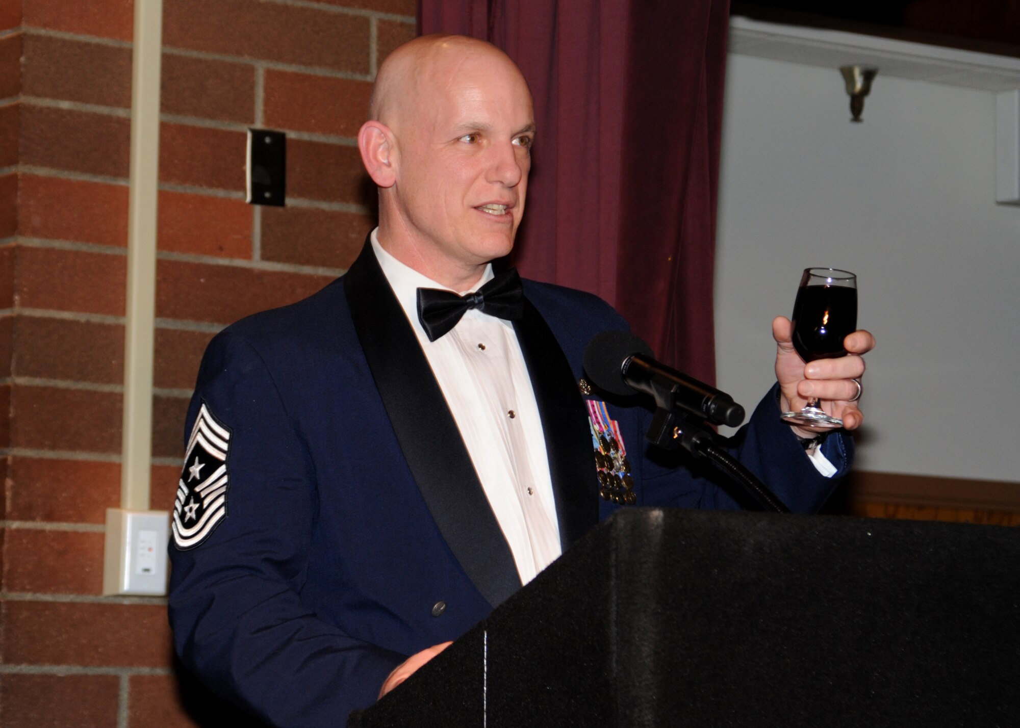 Command Chief Master Sgt. Gregory Warren, right, 62nd Airlift Wing command chief, delivers a speech during a Chief’s Recognition Ceremony March 2, 2012, at Joint Base Lewis-McChord, Wash. (U.S. Air Force photo/Master Sgt. Chris Haylett)
