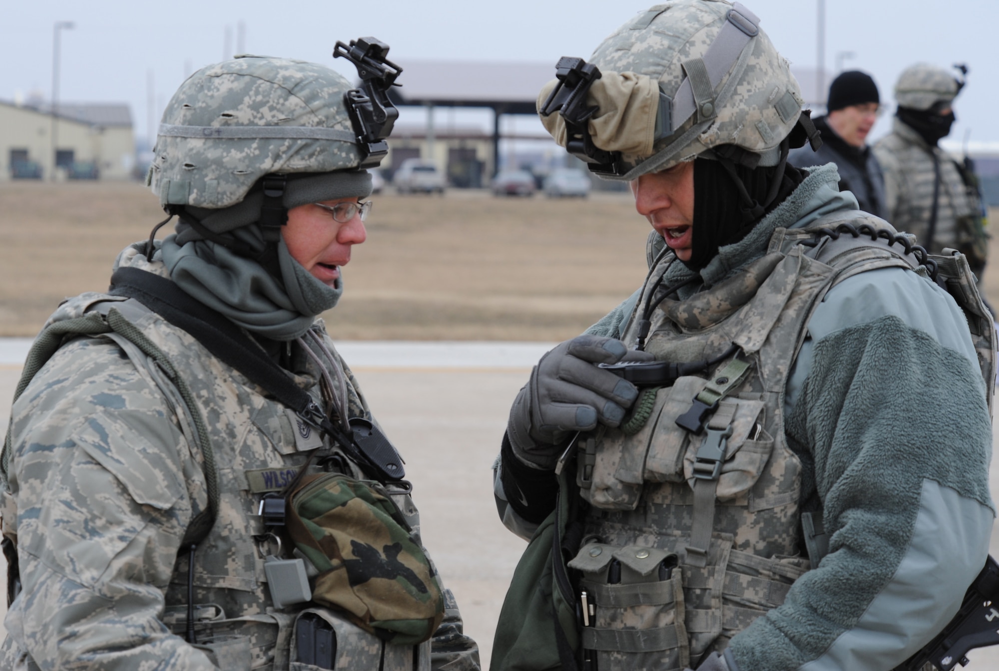 WHITEMAN AIR FORCE BASE, Mo. -- Members of the 509th Security Forces Squadron communicate over the radio with other team members during a Nuclear Surety Inspection Jan. 21. Whiteman AFB finished the NSI with 22 teams and 27 individuals recognized as superior performers, totaling 143 personnel. (U.S. U.S. Air Force photo/Airman 1st Class Bryan Crane)