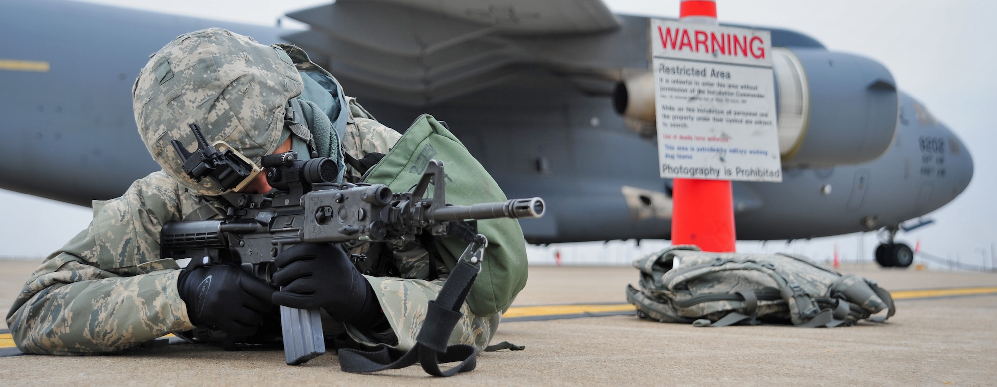 WHITEMAN AIR FORCE BASE, Mo. – Airman 1st Class Keena Johnson, 509th Security Forces Squadron patrolman, provides security for a C-17 Globemaster during a nuclear surety inspection Jan. 20. This NSI was a detailed assessment designed to evaluate the unit’s ability to carry out its nuclear mission. Areas evaluated encompassed technical operations, management and administration, security, logistics movement, safety, maintenance facilities and supply support.  (U.S. Air Force photo/Senior Airman Nick Wilson)
