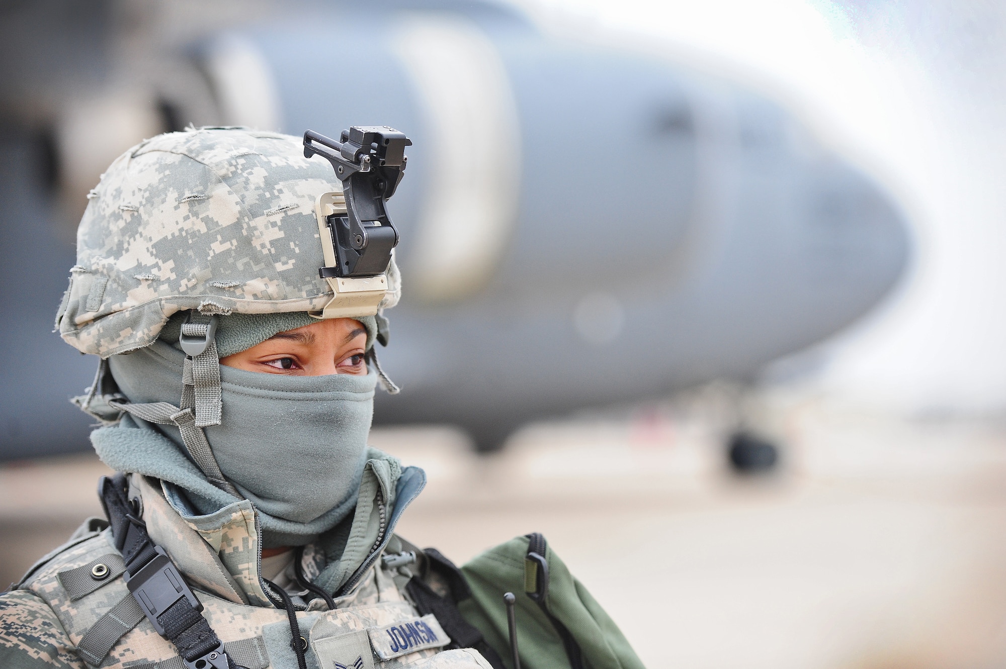 WHITEMAN AIR FORCE BASE, Mo. -- Airman 1st Class Keena Johnson, 509th Security Forces Squadron patrolman, provides security for a C-17 Globemaster during a Nuclear Surety Inspection Jan. 20. This NSI was a detailed assessment designed to evaluate the unit’s ability to carry out its nuclear mission. Areas evaluated encompassed technical operations, management and administration, security, logistics movement, safety, maintenance facilities and supply support.  (U.S. Air Force photo/Senior Airman Nick Wilson)