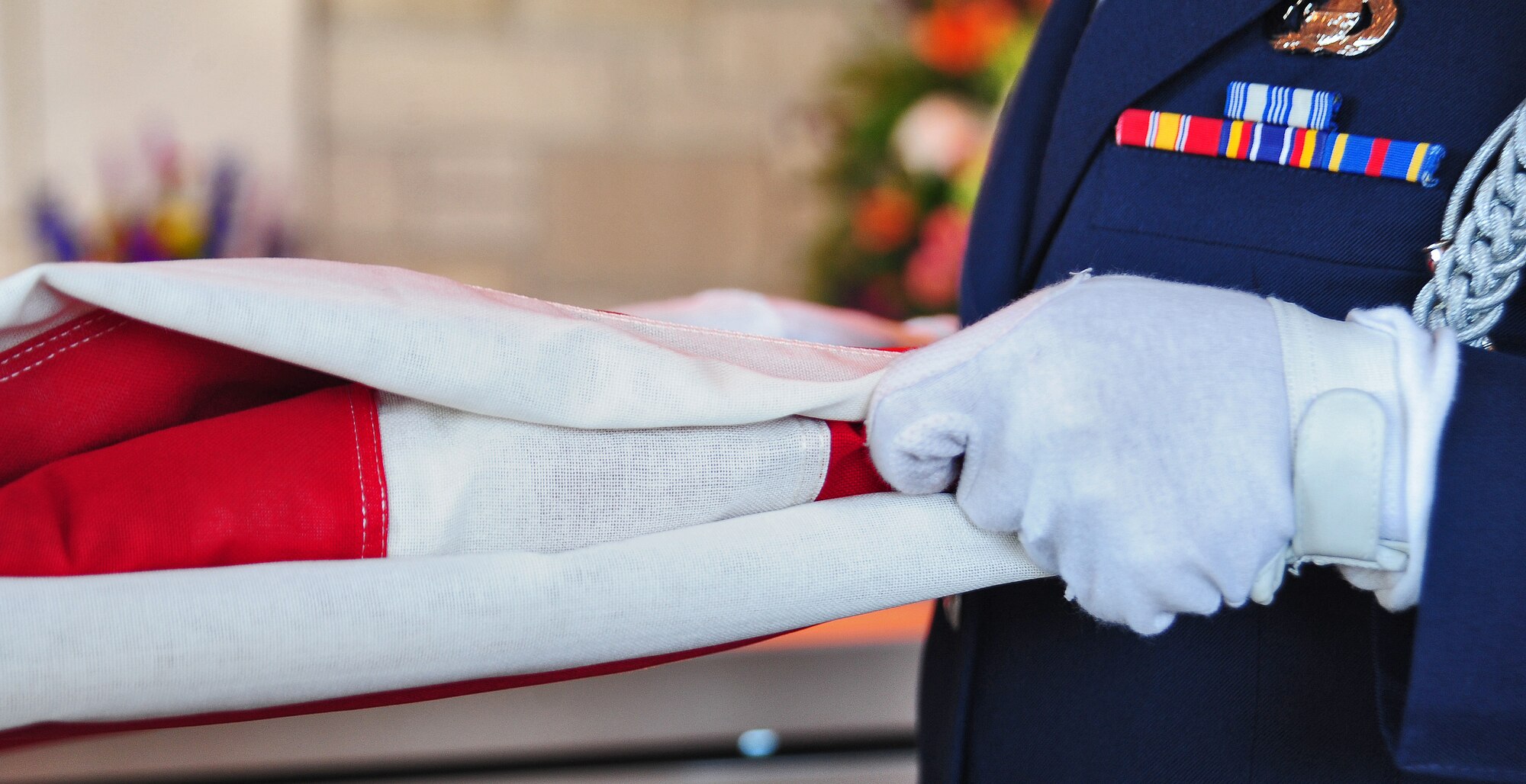 HIGGINSVILLE, Mo. -- The American flag is folded by a ceremonial guardsman from the 509th Bomb Wing Honor Guard salute for a fallen servicemember during a funeral at the Veteran’s Cemetery Jan. 10. With a team of 44 Airmen ranking from airman basic to technical sergeant, the 509th BW Honor Guard has a mission that covers the state of Missouri to include 118 counties. (U.S. Air Force photo/Senior Airman Nick Wilson)
