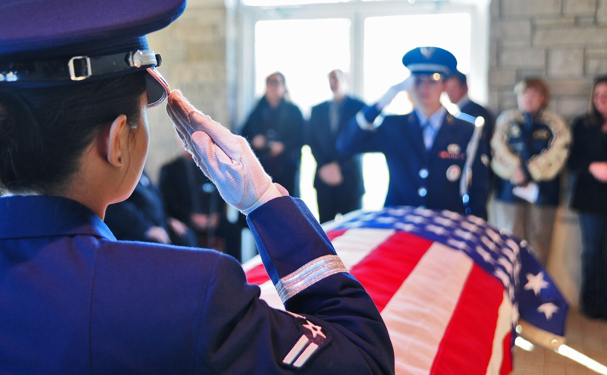 HIGGINSVILLE, Mo. -- Ceremonial guardsmen from the 509th Bomb Wing Honor Guard salute for a fallen servicemember during a funeral at the Veteran’s Cemetery Jan. 10. With a team of 44 Airmen ranking from airman basic to technical sergeant, the 509th BW Honor Guard has a mission that covers the state of Missouri to include 118 counties. (U.S. Air Force photo/Senior Airman Nick Wilson)