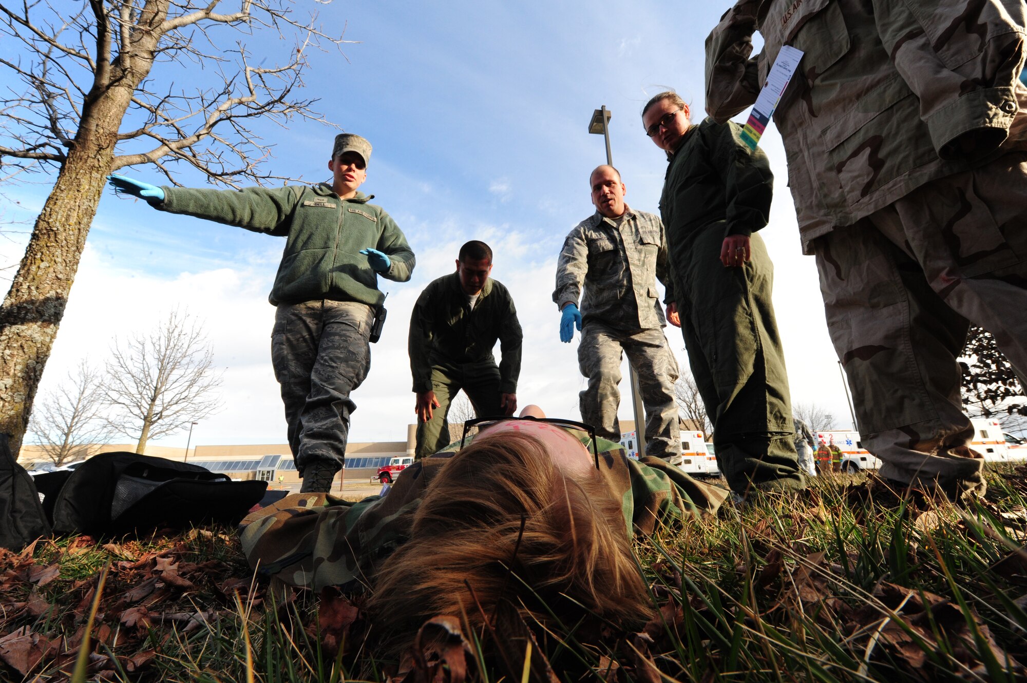 WHITEMAN AIR FORCE BASE, Mo. -- First responders from the 509th Medical Group arrive on scene to provide medical assistance to a moulaged victim during a Major Accident Response Exercise Feb. 23. The MARE gives base agencies an opportunity to work alongside personnel outside their career fields. Medical responders, police forces and Airmen from the fire department all played a role in the exercise. (U.S. Air Force photo/Senior Airman Nick Wilson)