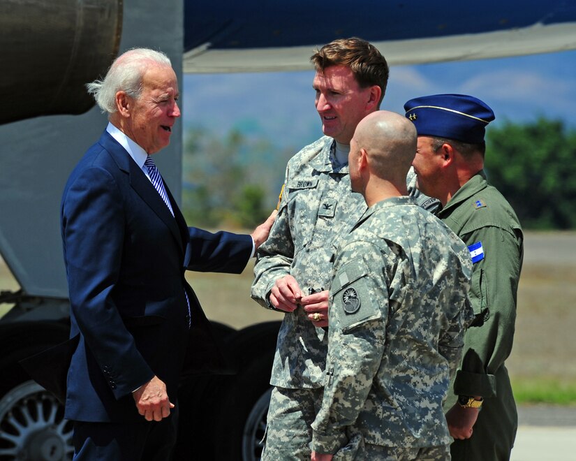 SOTO CANO AIR BASE, Honduras -- Colonel Ross Brown, Joint Task Force-Bravo commander, Lt. Col. Jorge Muñoz-Rivera, Director of the Honduran Air Force Academy and Command Sgt. Maj. Andrew Barteky, JTF-Bravo CSM, greet Vice President Joe Biden after he arrived here Mar. 6 to hold a bilateral meeting with President Lobo in Tegucigalpa. In addition, he will take part in a meeting with Central American leaders, who have been invited to a joint meeting by President Lobo, the current President Pro Tempore of the Central American Integration System. (Photo/Martin Chahin)