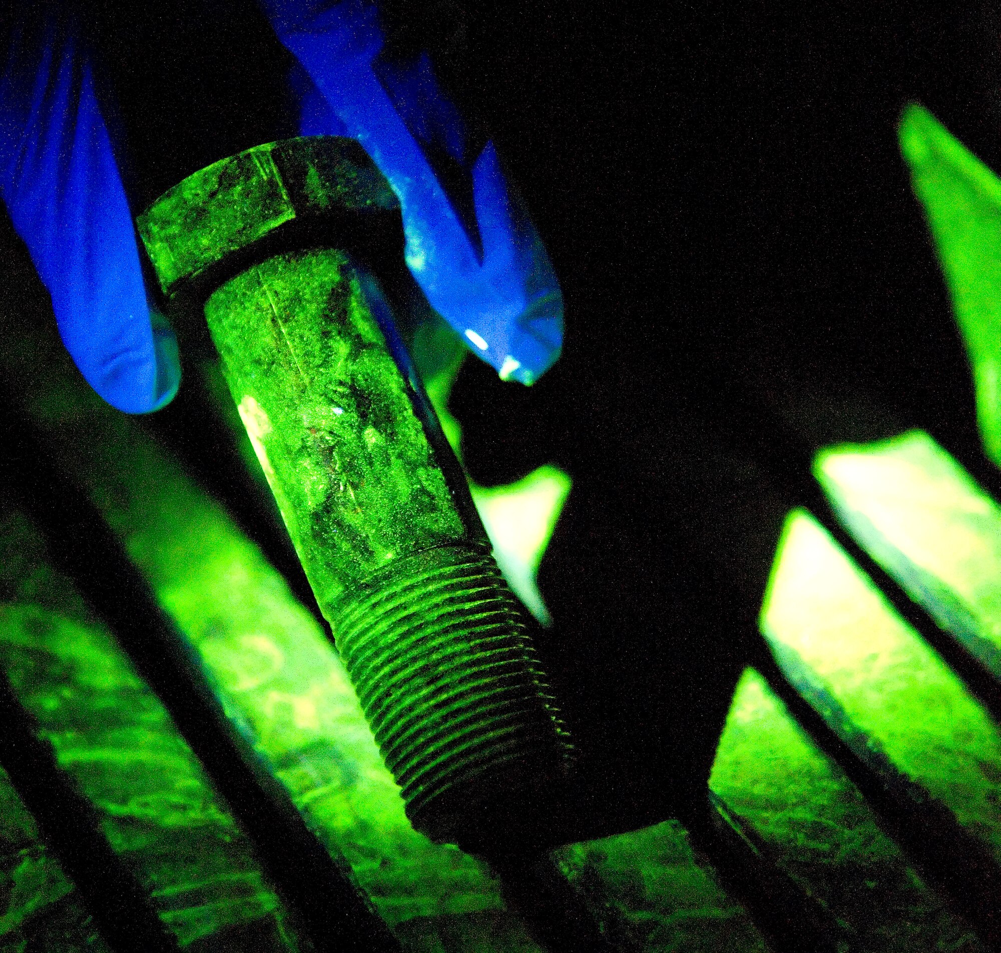 A bolt undergoes a penetrant inspection at Dover Air Force Base, Dover, Del., Feb. 17, 2012. The Fabrication Flight performs the inspection and repair of aircraft system components. (U.S. Air Force photo by Adrian R. Rowan)
