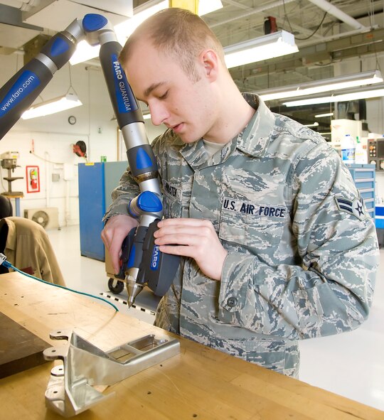 Airman 1st Class Joshua Prostek, a metals technology journeyman with the 436th Maintenance Squadron Fabrication Flight, operates a Faro Arm which scans parts into the computer to make parts at Dover Air Force Base, Dover, Del., Feb. 17, 2012. The Fabrication Flight performs the inspection and repair of aircraft system components. (U.S. Air Force photo by Adrian R. Rowan) 

