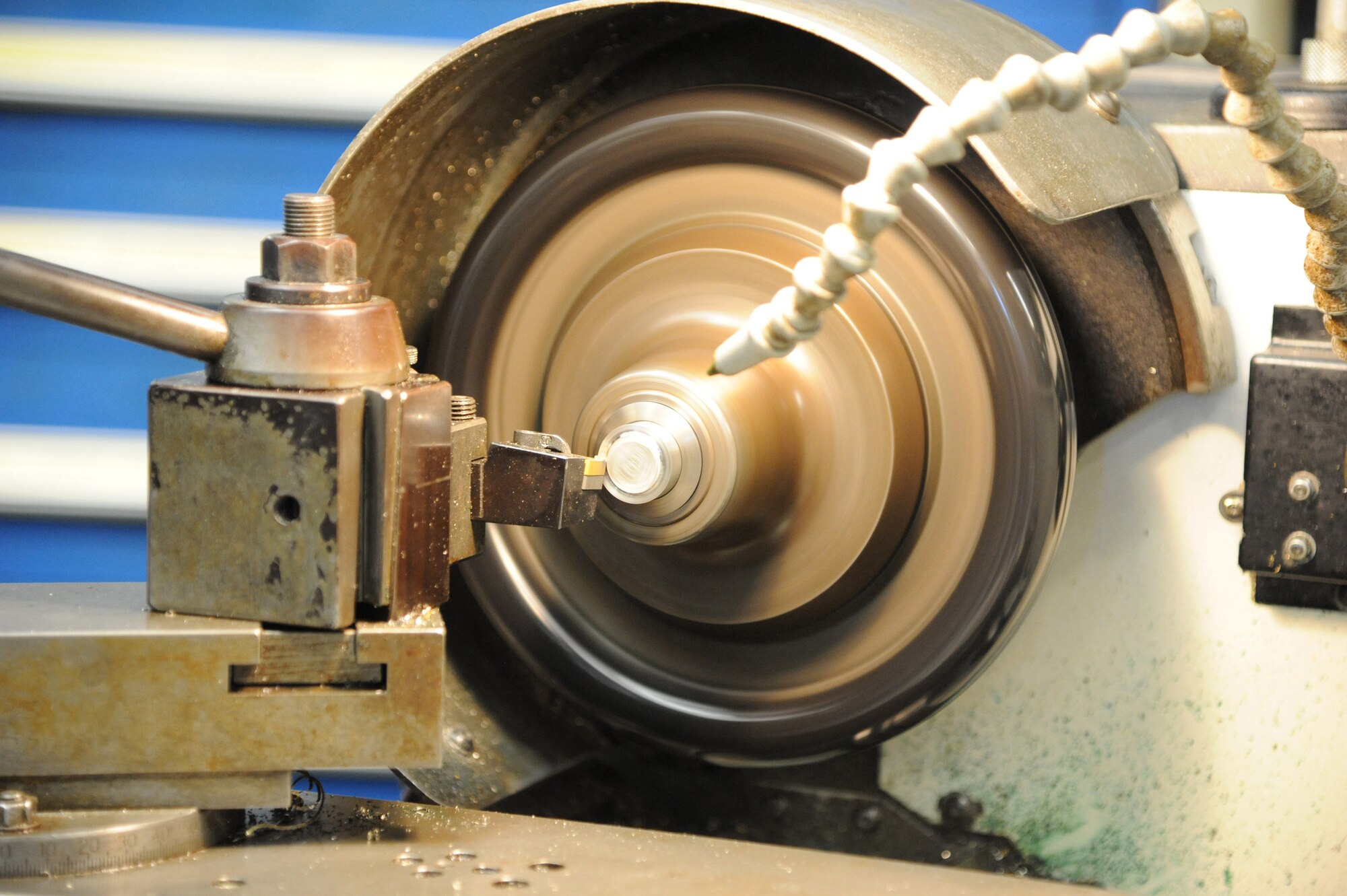 Rob Wooley, 902nd Mission Support Group Trainer Development Division, uses a lathe to turn down a small part for a Barany Chair on Joint Base San Antonio-Randolph March. 5. JBSA-Randolph manufactures the Barany Chair for all of the Defense Department.(U.S. Air Force photo by Rich McFadden) (released)