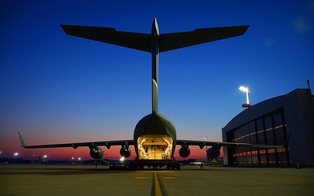 WRIGHT-PATTERSON AIR FORCE BASE, Ohio – Senior Airman took first place in the 2011 Air Force Reserve Command Media Contest’s feature pictorial photograph category with this photograph of a 445th Airlift Wing C-17 Globemaster III sitting on the ramp during a fuel stop at Ramstein Air Base, Germany, in preparation for its return home after participating in the 2011 Air Show & Lifestyle Expo at Waterkloof Air Force Base, Pretoria, South Africa, Oct. 1, 2011. (U.S. Air Force photo/Senior Airman Mikhail Berlin)